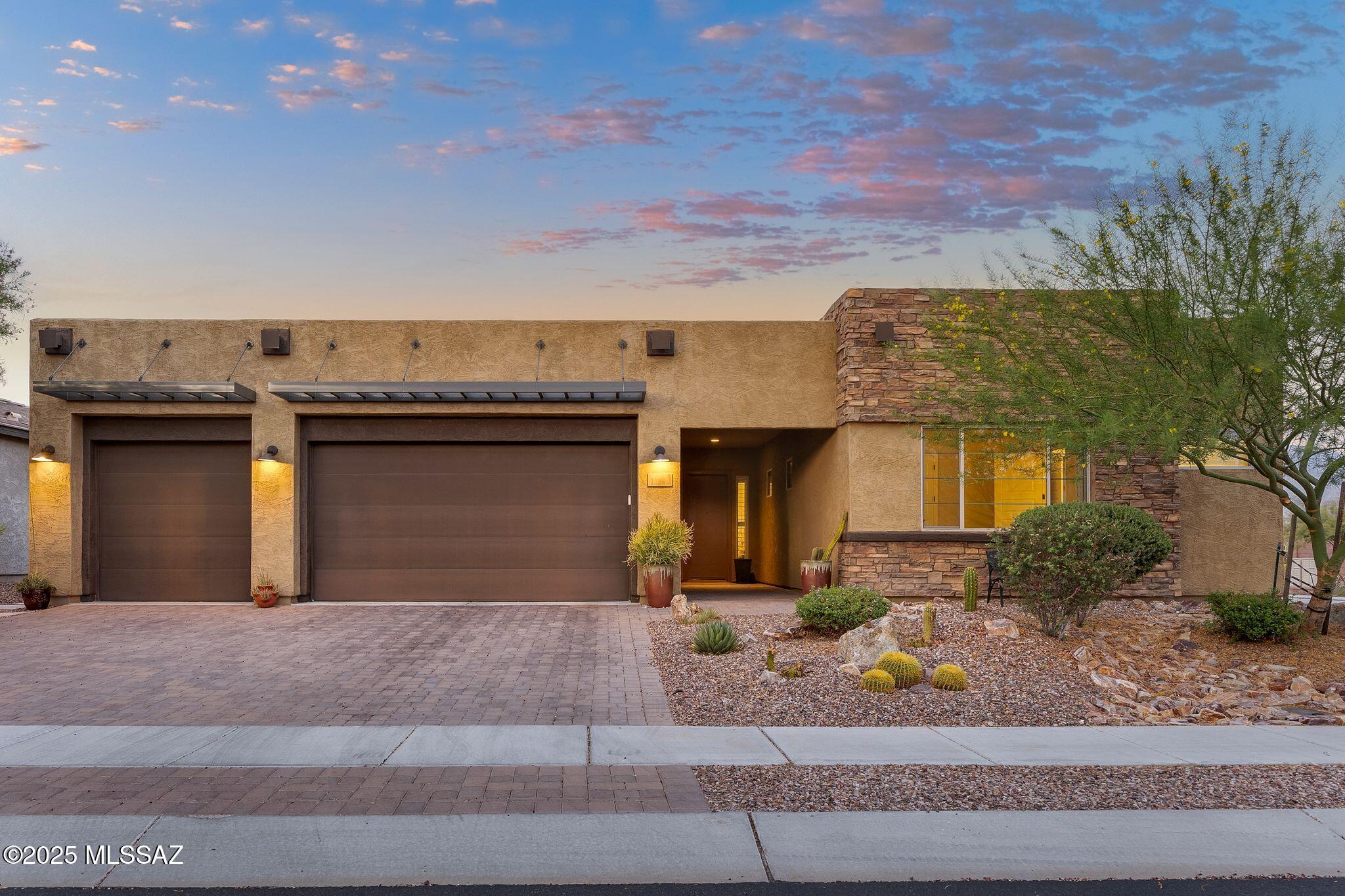 Discover Luxurious Living in this Stunning Desert Contemporary Home w/ Sparkling Pool & Gorgeous Catalina Mountain Views in a Prime Oro Valley Location. Situated on a Corner Lot w/ a Serene Greenbelt Backdrop & Excellent Privacy, this Meticulously Designed Mattamy Property is Located in the Premier, Gated Community of Alterra at Vistoso Trails. Built in 2019, the Spacious 3,236SF Split Bedroom Floorplan w/ 5Bd/3.5Ba+Bonus Den/Media Room Offers Space for Everyone! The Gourmet Kitchen Showcases an Impressive Center Island, Tiled Backsplash, Contemporary Pendant Lighting, Granite Countertops, 36'' Gas Cooktop, SS Appliances, Large Food Pantry & Ample Cabinetry. The Great Room, w/ Soaring Ceilings, Ample Natural Light, Gas Fireplace, Media Center & 75'' TV Inspires Fun Gatherings For All! Smart Home Features, Including Ceiling Mounted Patio, Living Room & Owner's Suite SONOS Surround Sound Speakers & Controllable HVAC, Irrigation & Pool Equipment with UV & Ozone Filters Add Effortless Convenience. The Owner's Suite is a True Sanctuary w/ a Custom-Tiled Shower, Soothing Garden Tub, Dual Vanities & Breathtaking Mountain Views. Modern Touches Like Ethernet, Water Softener, Reverse Osmosis, Tankless Water Heater & Central Vacuum Ensure Comfort & Ease. Ample Storage Solutions, including a 3-Car Garage w/ Wall Mounted Shelving, Custom-Built Laundry & Office Shelves & Dual Primary Closets, Keep Life Organized. Outside, the Sparkling Pool, Spa & Beautiful Landscaping Create a Resort-Like Escape. Wind Down in the Evenings w/ Stunning Mountain Views from Your Upper Sunset Deck or Enjoy the Sunrise & Coffee Under the Covered Patio. Enjoy Direct Access to the 131-Mile Loop Trail & Being Only Minutes Away from Hiking Trails, Parks, Shopping & all of the Local Goods Oro Valley has to Offer.  This Cherished Home, w/ Every Detail Considered, Awaits Your New Chapter. Schedule Your Private Showing Today!
