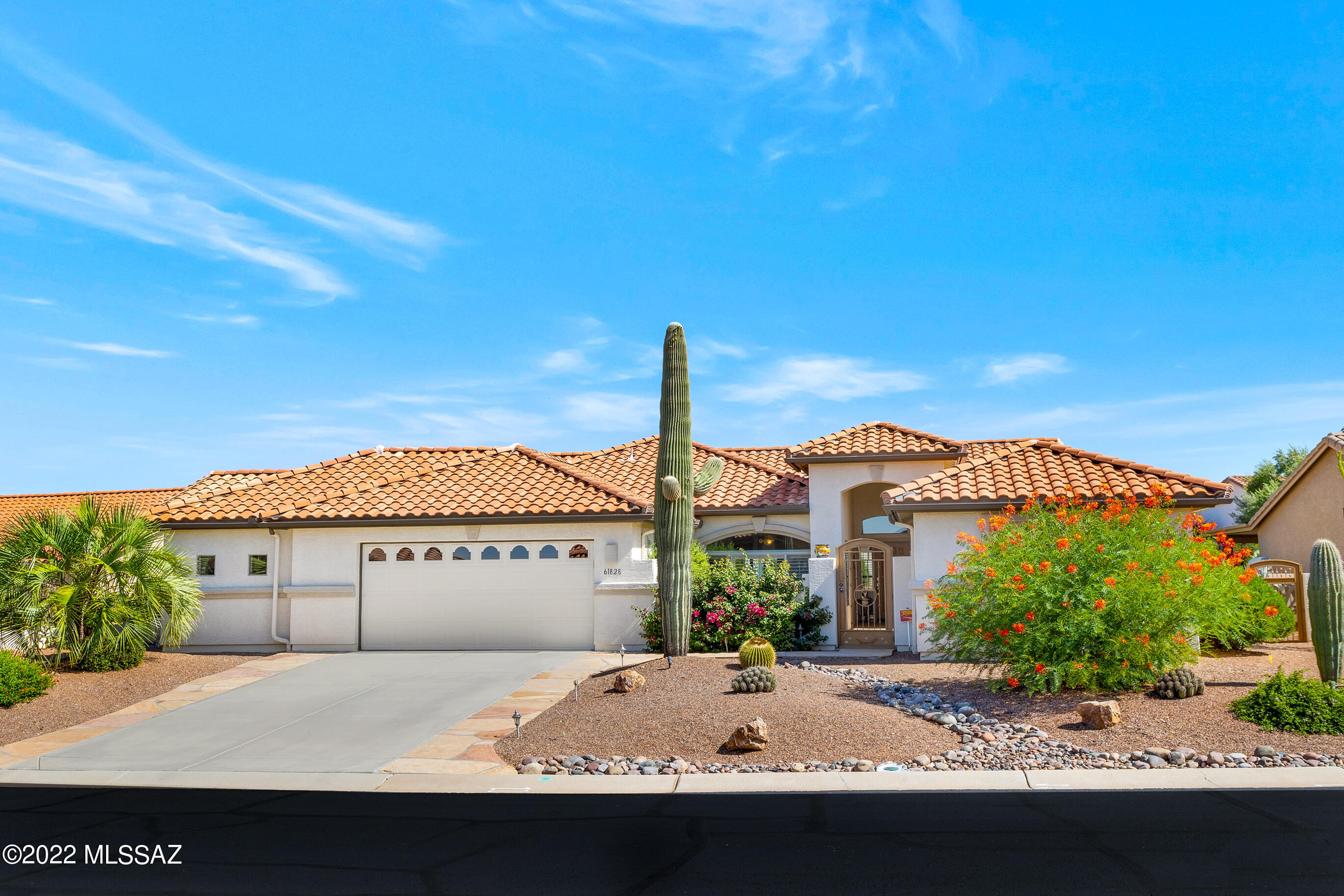 Popular LAREDO split-bedroom, great-room floor plan with guest casita located in SaddleBrooke, Tucson's Premier Active Adult Retirement Community. This home has it all: a nicely lit art studio is attached to the garage with its own mini-split HVAC unit and built-in storage & desk, in front of that is a side-entry golf cart garage accessible thru the main garage door. New HVAC in main home 16 SEER & casita 19 SEER June 2022! Kitchen features stonite countertops, gas range, microwave/convection unit, rollout shelving, ss sink, & island. Tile everywhere but the guest bedroom & casita. Bay window in the master bedroom. Full covered patio with electric sunshades. Lovely backyard with gas fireplace, gas BBQ hookup, raised gardens for your veggies and the list goes on.