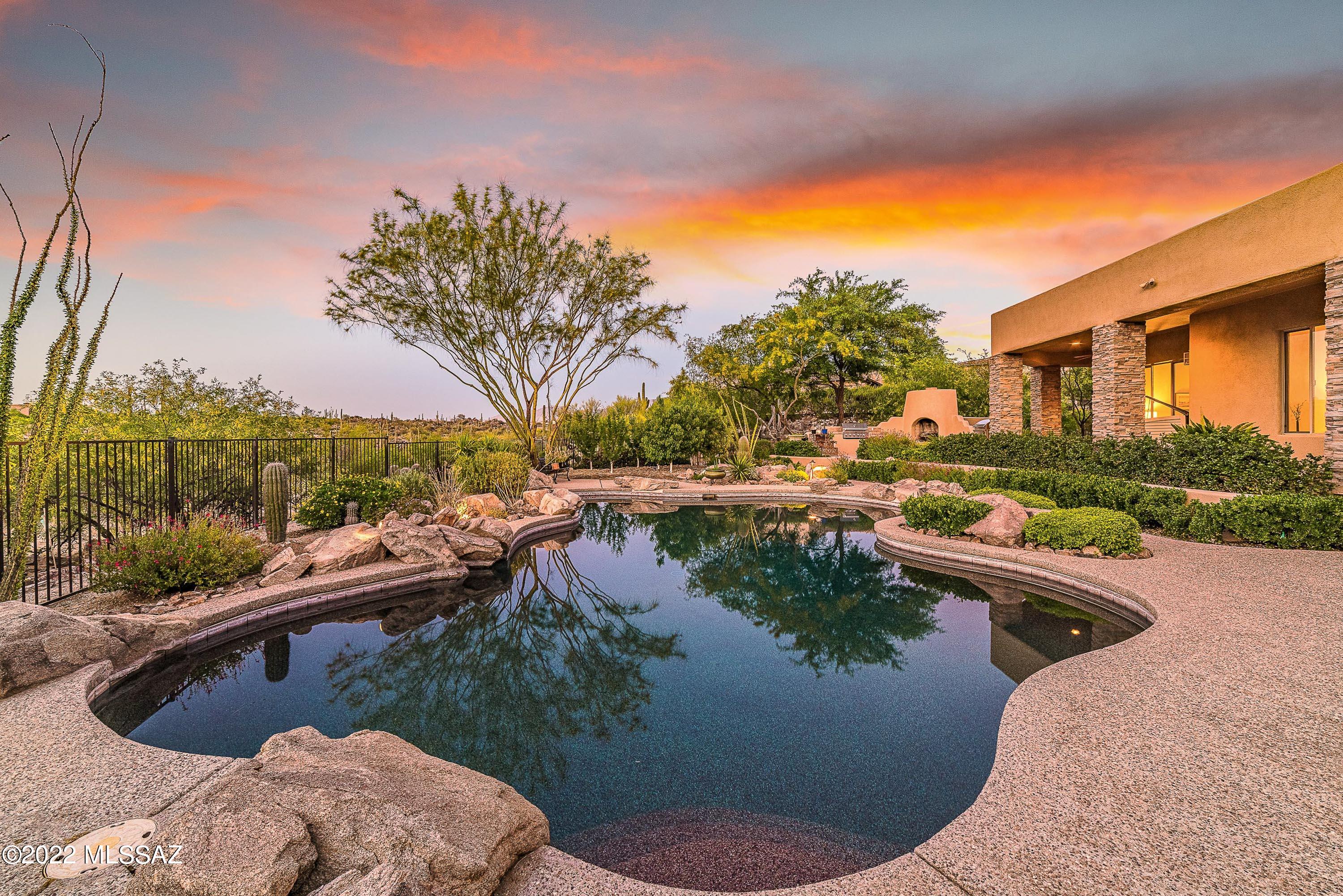 $200,000 price reduction - This wonderful home sits on immaculate desert landscaping in the highly desired Honey Bee Canyon Estates. ALL inspections completed & any repairs are finished, Now just waiting for its new owner to add their personal touches. The lowest price per sq ft luxury home in the NW priced at only $261 a sq ft - THERE IS NOTHING ELSE LIKE IT.  This property is truly a private retreat with no rear neighbors, relaxing pool, outdoor grill & fireplace - all which is situated at the back of the community on a quiet cul-de-sac & surrounded by conservation easements.  Enter the charming courtyard w/ fountain and you will feel a sense of calm & easy living - almost ZEN like.  Honey Bee Canyon Park is right next door w/ miles of hiking trails. 4 car garage w/ 8 ft extension for trucks, boats, toys and so much more. Honey Bee Canyon Park is right next door w/ miles of hiking trails. Fantastic split floor plan including large bedrooms and oversized closets. Perfect NEXT-GEN layout - 3 different sections for parents, grand kids, children & everyone else. Kitchen features an oversized pantry and has all you could ever need including - double ovens, both gas & electric stoves, warming drawer, wet bar, pantry, stainless appliances, granite & center island. Newer HVCS, entire exterior just repainted, new landscaping lights & irrigation. Contractors confirm this home could not be rebuilt for less 2M - then factoring in the lot premium for a 1.27 acre lot with total privacy, pool & 100ks in landscaping = This is a true MUST SEE!!
