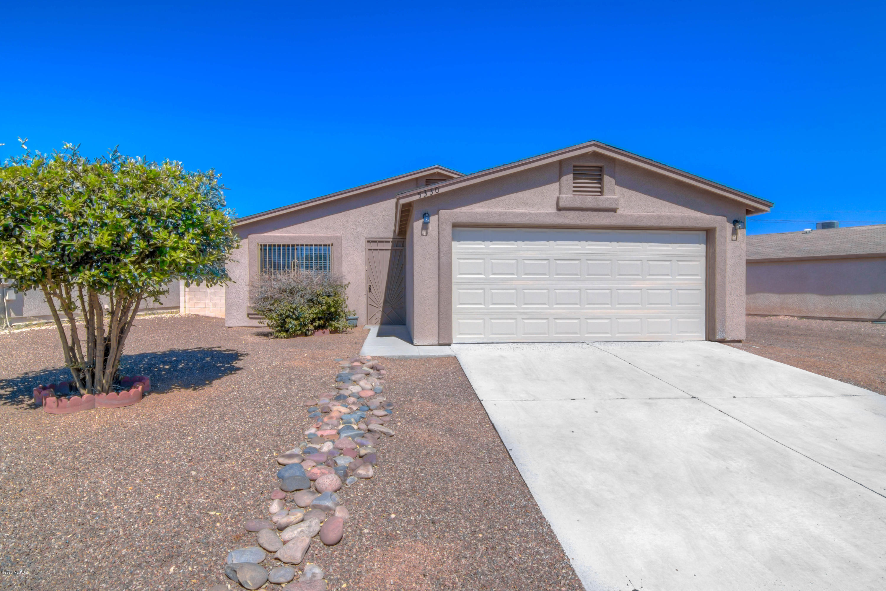 Beautifully renovated home in a quiet little neighborhood!  Enjoy natural light in every room, fresh paint and all new flooring.  The kitchen features beautiful new cabinets & countertops.  Bedrooms and bathrooms are spacious and modern.  Roof is only 2 years old.  Front yard has neat low care landscaping and backyard is enormous! This house is like brand new and move in ready!