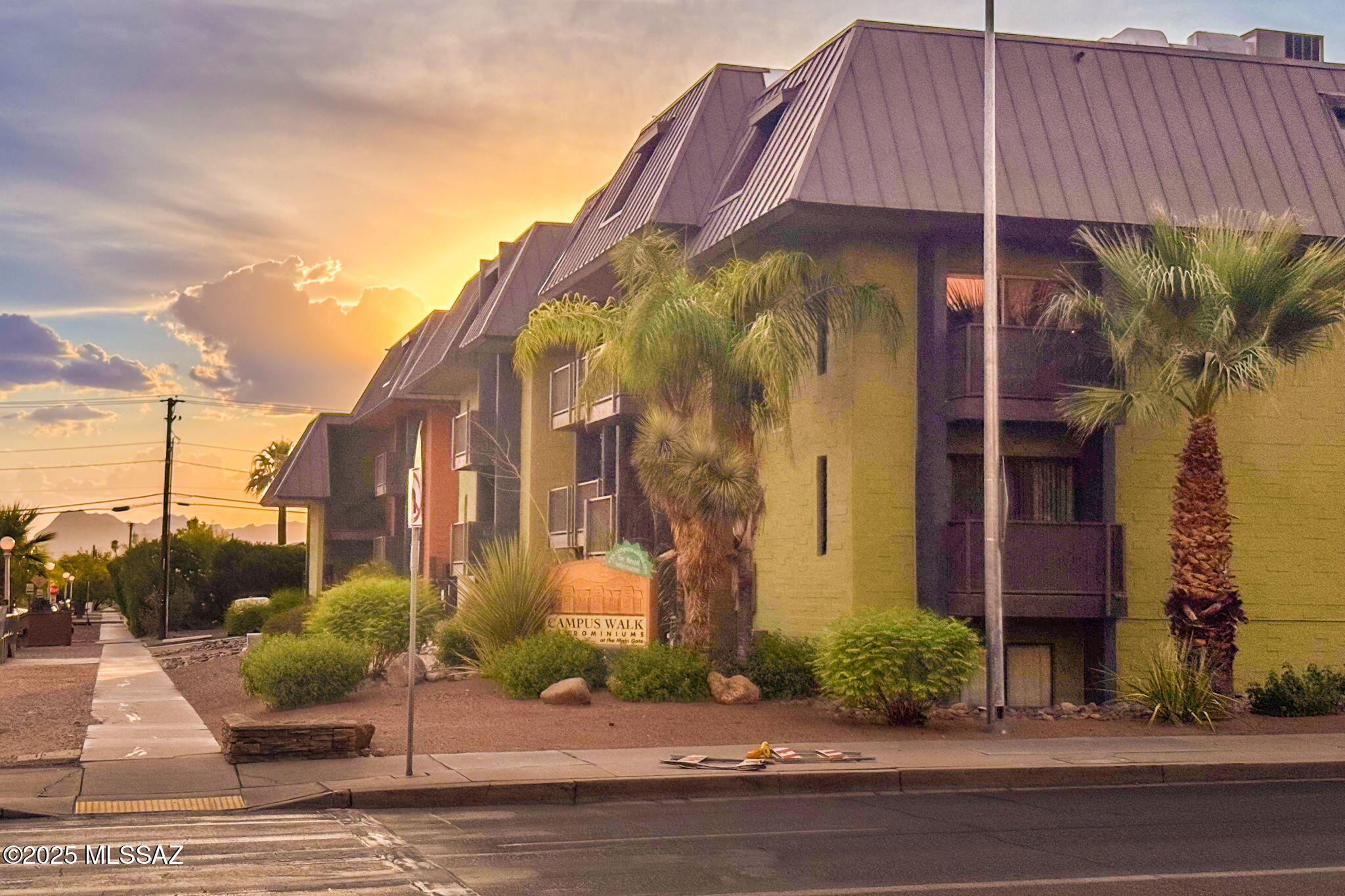 Spacious 2-bedroom, 2-bath condo in Campus Walk Condominiums, ideally located adjacent to the University of Arizona. The first floor features a kitchen and half bath that open to the living room, with granite counters and stainless steel appliances creating a stylish, low-maintenance cooking space. Step through the sliding doors to a private balcony overlooking Euclid. Downstairs, two bedrooms offer flexibility for the future owner. The downstairs bathroom continues the granite finishes with subway tile surrounds. A perfect opportunity in a prime location—ideal for students, faculty, or investors.