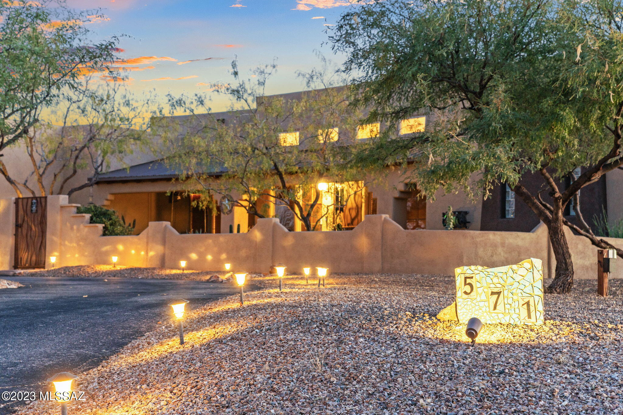 You know the home that all of the kids and family want to gather at? THIS is it! Welcome to your dream home! This stunning 4 bedroom 4 bath home boasts exceptional features designed for luxury living and entertainment.  Just over an acre and on a corner lot you have your own private sports oasis with a dedicated basketball and pickleball court and over 4000 sq ft of turf perfect for soccer or ball practice. Hop in the newly completed and redesigned pool with 56x23 ft of cooling deck (no burning your feet in our hot summers), sunning step for relaxing or melt away in the hot tub while BBQ-ing on the grill. Grab a lemon off of one of the many fruit trees. Car enthusiasts will appreciate the extended 3 car garage with mini split to keep it cool, and separate 2 car garage to store your toys. The huge media/rec room can host slumber parties, large family gatherings, or the perfect movie night.  Surround sound thru out the home, tankless water heaters, UV light water softener, newer blinds throughout house, newer UV window screens, whole property wi-fi, wired in ethernet, whole exterior painted 11/2023. Roof re-coated 11/2023. NO HOA! Top rated Vail school district and close to I-10, shopping and town.  Only 15 minutes from Raytheon, 25 minutes from downtown, and 30 minutes from U of A. The comfort, upgrades and entertainment options truly set this home apart and puts it at the top of your list!