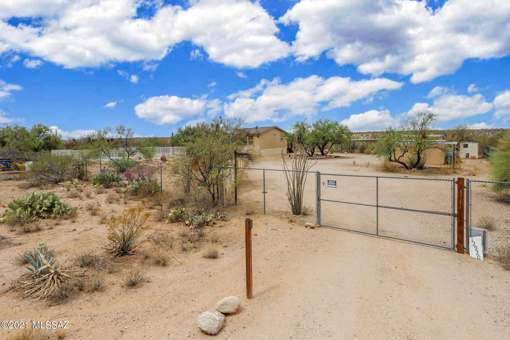 Beautiful Desert Oasis, Horse Property, Vail Schools...What more could you want?! How About A Charming 3 BD/2 BA Home at the End of the Road on Almost 5 Acres, Almost 1 Acre Fully Fenced, Gated Entry, Sparkling Pool & Abutting State Trust Land. This Bright & Open Split Floor Plan Features Newer Beautiful Laminate in Kitchen/Dining Area, Large Kitchen w/ Island, Wood Burning Fireplace w/Beautiful Tile Surround, Ceiling Fans Throughout, Huge Master Retreat w/Garden Tub & Separate Shower. Enjoy Stunning Views & the Tranquil, Private Setting from your Large Covered Porch Overlooking the Pantano Wash, Extravagant Sunsets, Twinkling City Lights and Unbelievable Stargazing!
Above standard 2'' x 6'' exterior walls, Workshop/Garage that can be Fixed Up...The Possibilities are Endless! Owner/Agent.