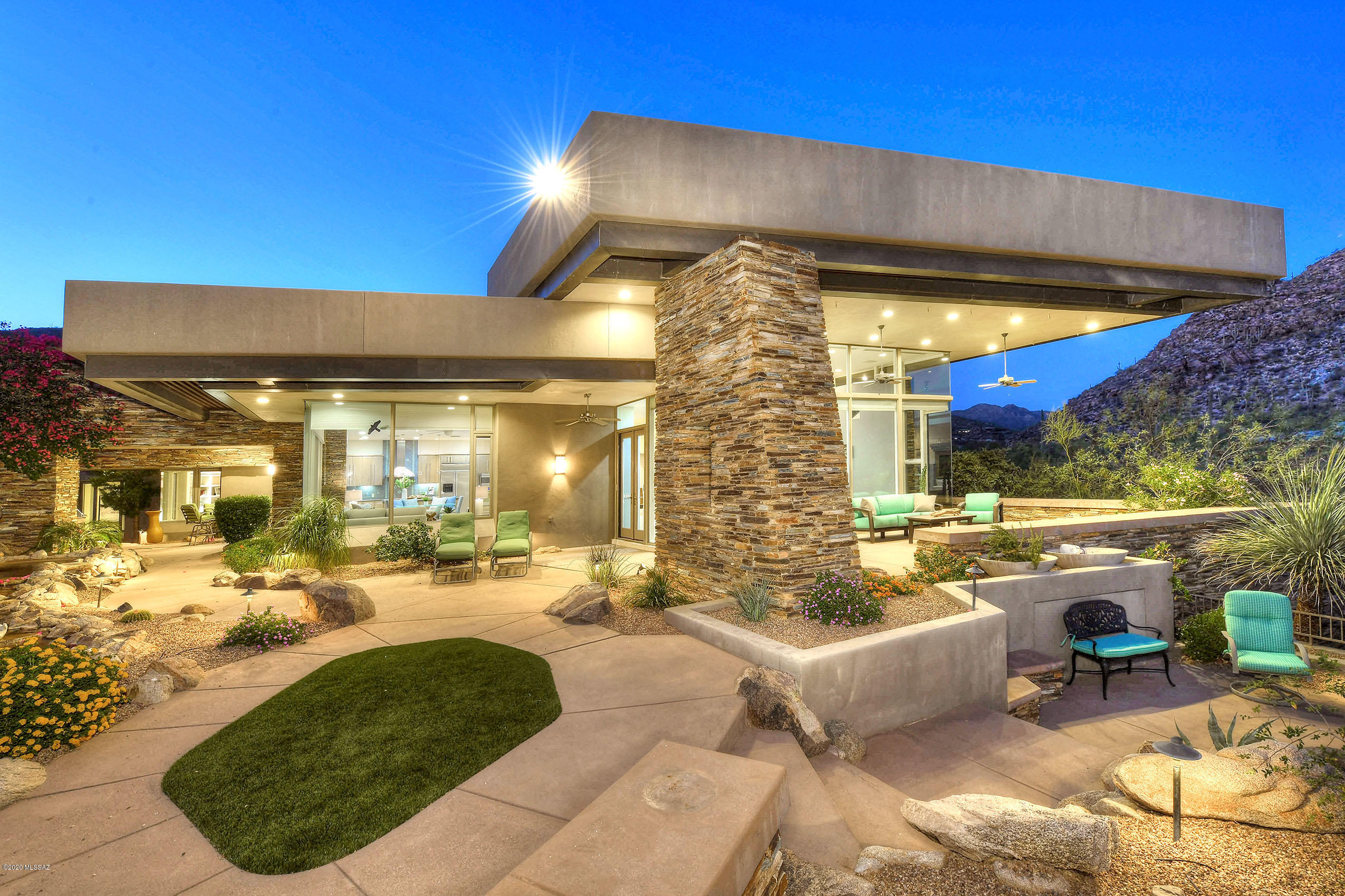 *HOLIDAY SPECIAL* FREE $25K GOLF MEMBERSHIP TILL 12/31/2020*  TIMELESS CONTEMPORY NESTLED ON THE ''BEST LOT'' IN CANYON PASS!! INCREDIBLE GOLF COURSE- GALLERY NORTH, MTN & BRILLIANT CITY LIGHTS FOREVER! BUILT BY LA QUINTA HMS! SOLID MASONRY! DESIGNED TO BRING THE OUTDOORS- IN! ORGANIC NATURAL FABRICATIONS/TONES & STONE CREATE A *DESERT* RETREAT! BREATHTAKING ROCK WATERFALLS... MEMORABLE FEATURE! INTERESTING LAYERED BKYD -PLENTY OF PATIOS/VERANDAS TO ENJOY TUCSONS OUTDOOR LIVING! ALFRESCO KIT/DINING COZY CHAT/LOUNGE AREA W/FP & STUNNING VIEWS! *GATHERING ROOM* FLOOR/CEILING GLASS, OPEN FP, WET BAR & FORMAL DINING- PERFECT TO ENTERTAIN! GOURMET KIT- BUTLERS PANTRY, GRAY ALDER CABS, GRANITE SLABS, FR WALL OF GLASS FOR CITY VIEWS! OFFICE/ MURPHY BED, GUEST SUITE, HUGE 2 GAR, LIMESTONE FLRS
