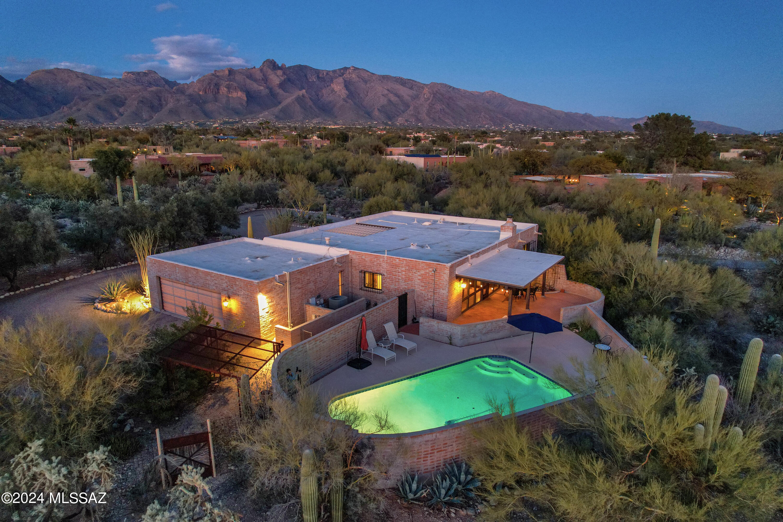 Welcome to your new home in Catalina Foothills Estates No 7 .This graciously updated three bedroom, two bath home sited on a 1 acre lot with gorgeous mountain and city views This open concept floor plan features an expansive cooks kitchen with custom cabinetry , quartz countertops and tons of storage. beautiful natural light w/ dual paned windows & north /south exposure. Outdoor space includes Enclosed ft entry courtyard to keep flowers or plants in . Relax on the covered patio or take a dip in the pool. Experience the convenience of being close to a vibrant social scene and shopping areas. Short commute to Banner medical and the University of Arizona ensures that work, education and healthcare are nearby.