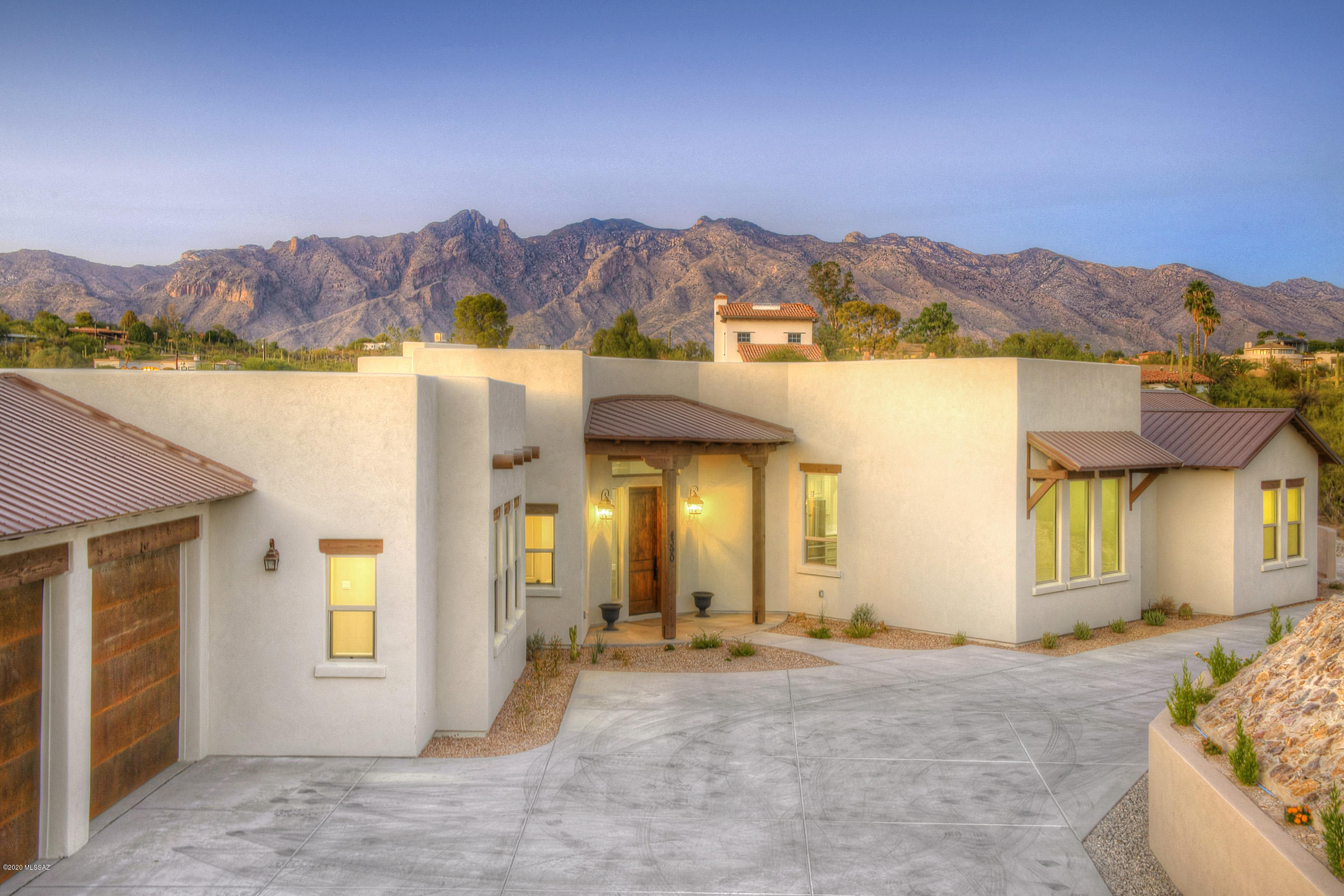 Gorgeous Brand New Luxury Home in the heart of the foothills with incredible mountain views, walls of windows to soak them in and stunning top of the line finishes thruout.  Features include sky high ceilings, split floorplan, enormous greatroom with a gas fireplace, beautiful island kitchen with quartz countertops and stainless steel THOR appliances that will surely delight the ultimate chef in your household.   Generous Master Suite with huge walk in closet and slider to your private covered patio area.   Pre-wired for smart home applications.  Perched high atop a 1-acre lot, the location just can't be beat and plenty of room for a pool. La Encantada, Banner and U of A only about 10 minutes away and Tucson Mall, St Phillips Plaza and the river walk are even closer.