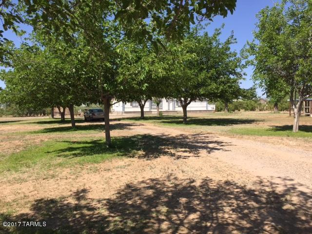Must See. Enjoy Arizona Great Outdoors! ESTATE SALE! 1.67 Acre Lot at End of  Street and Bordered by Public Land to the south. 4 Bedrooms plus Den. Fully Functioning Chicken Farm, with Hot Water Tank used for Space Heating. 24 x 8 Workshop on Concrete Foundation, Nicely Framed and Fully Wired. Two Large Concrete Pads on east and west Side of Home, Could Easily Become Carports. Sprinkler System covers Almost the Entire Lot. Lots of Room for All your Animals and Toys.  Full RV Hook-up. Ceiling damage prior to Roof Repair. This Home Needs Some work but Has so Much to Offer and is Priced Accordingly. Some Equipment will Stay with the Property, will Transfer in AS-IS condition. Great Opportunity!