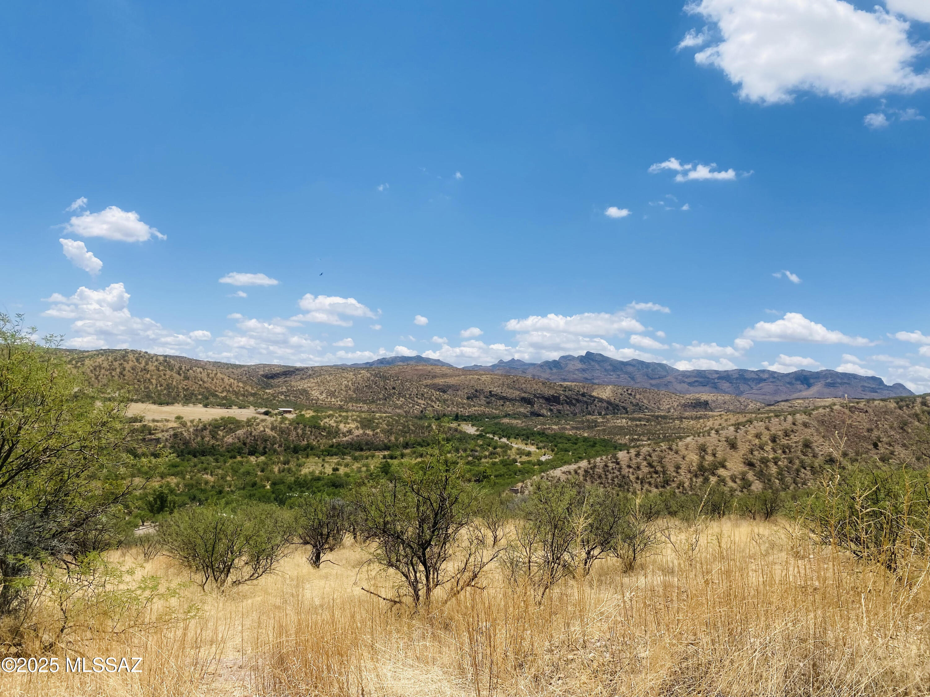 Seller financing available. Panoramic Views , Sunrises & sunsets. Beautiful, 2 acres plus. May be able to subdivide and build several houses. Large gently sloped lot.Views of the Atascosas, San Cayetano. Short distance to I-19 (Exit 22km), shopping, schools, fire station. Short distance to Rio Rico High School.