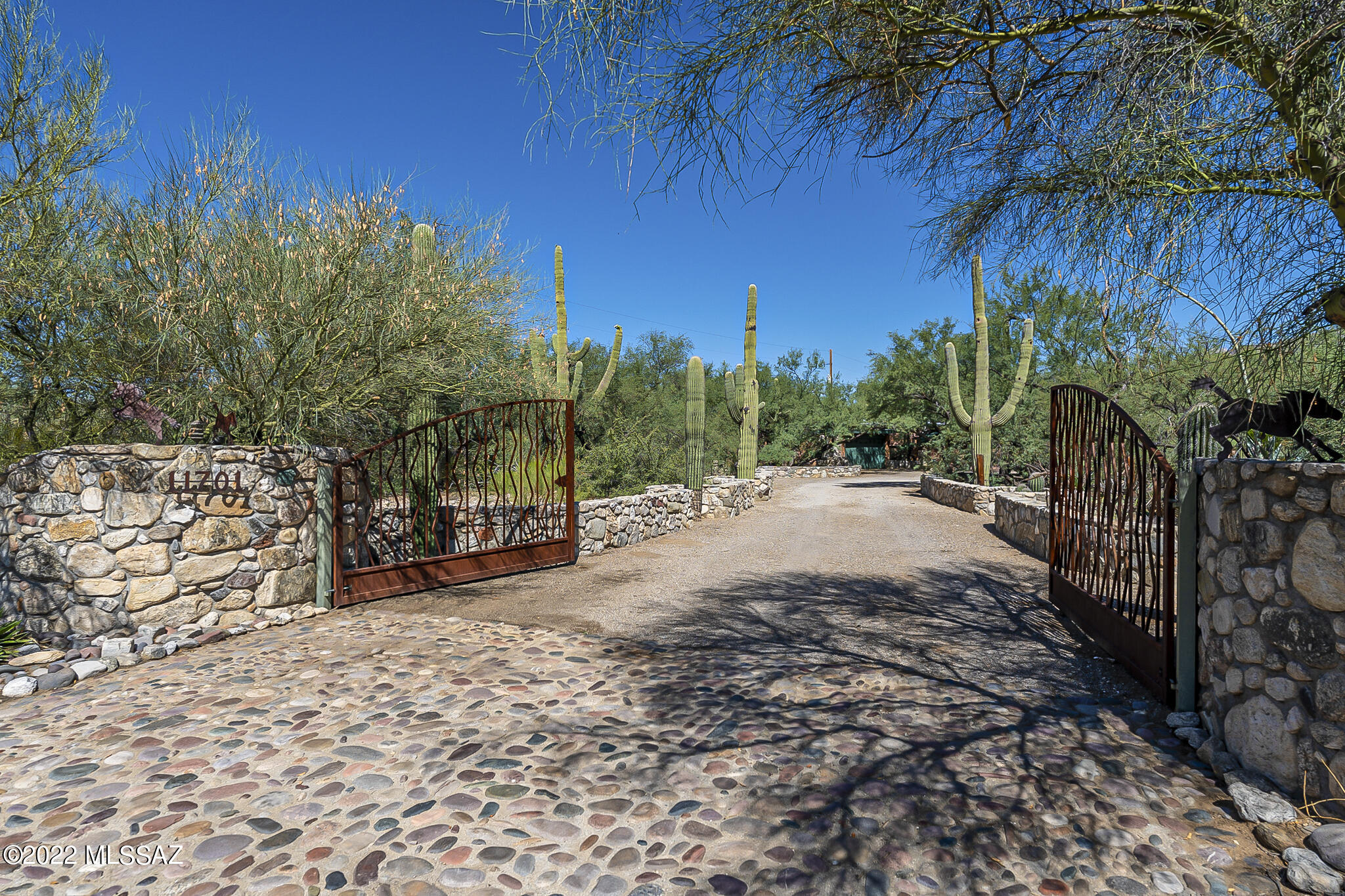 Lovely 3BR/2BA home in the Tanque Verde Valley with huge bonus room and full of Tucson Charm! Sitting on a 1.39 acre lot with mature vegetation and mountain views, this 2459 sqft home is sure to be the perfect setting to create years of great memories, entertaining, and lovely fall mornings having coffee on your stunning covered patios. This home boasts a cozy brick fireplace, picture windows throughout, a split floorplan, granite countertops, recently painted interior, large storage shed AND a huge workshop! Other great features include a water filtration system, newer HVAC, and rainwater collection system with a capacity of 3,000 gallons. Call for your private showing today!