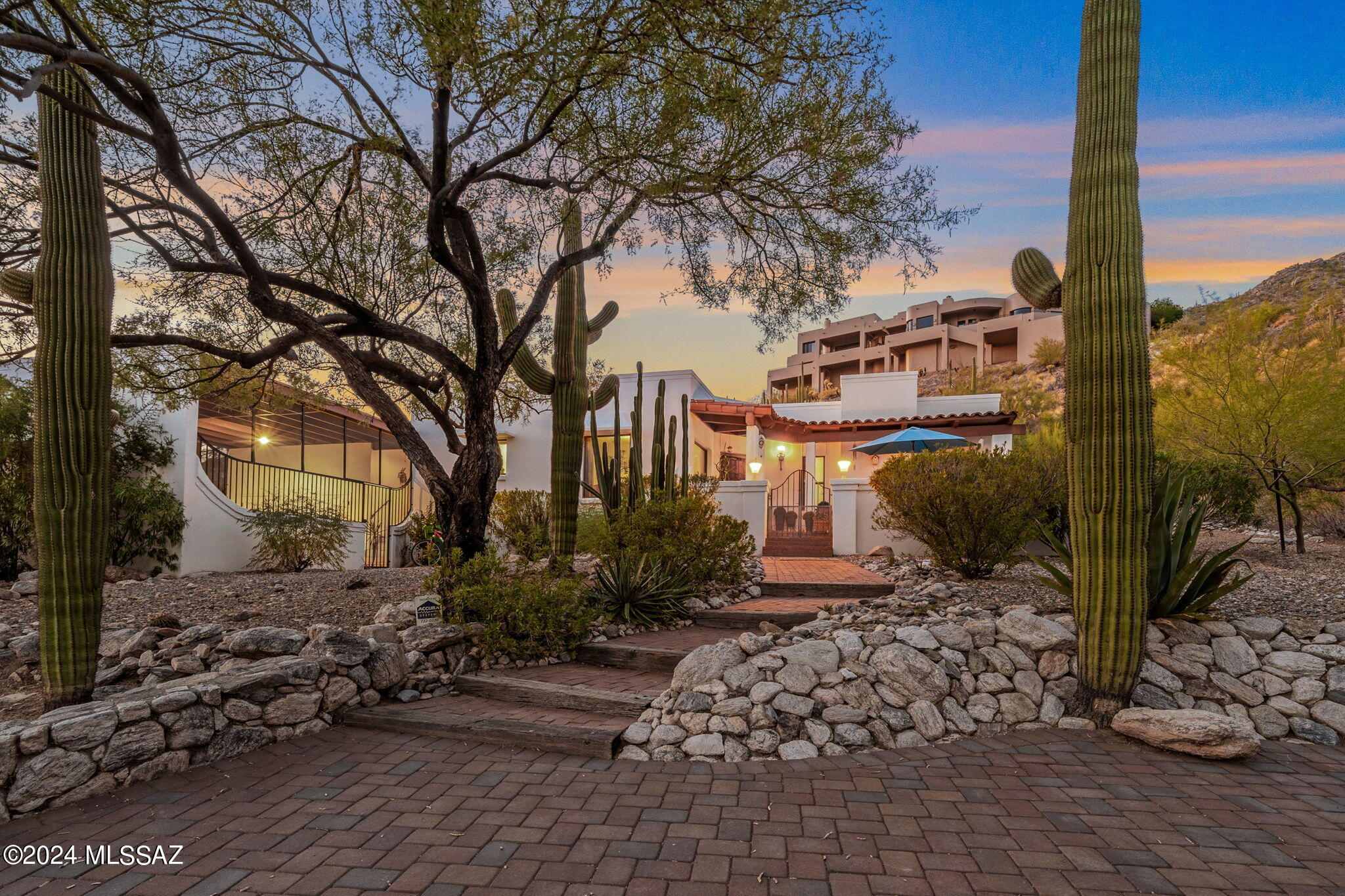 Discover your dream home atop the history rich Coronado Foothills. Located in the highly sought-after and top rated Catalina Foothills School District 16. Former home to the Pontatoc Silver Mine, This impeccably maintained home offers stunning mountain views, unmatched sunsets, mature saguaros, a modern floor plan and a large lot for a private and peaceful setting. Enjoy 2 spacious living areas, a bee hive fireplace in the living room, walk in closet in the master suite, a modern kitchen, and Arizona room/ outdoor space perfect for relaxing or entertaining. The home features elegant finishes and plenty of natural light. Exceptional hiking trails, shopping and dining nearby. top of the line HVAC, new water softener & Generac generator with transferable warranty.Schedule your showing today!