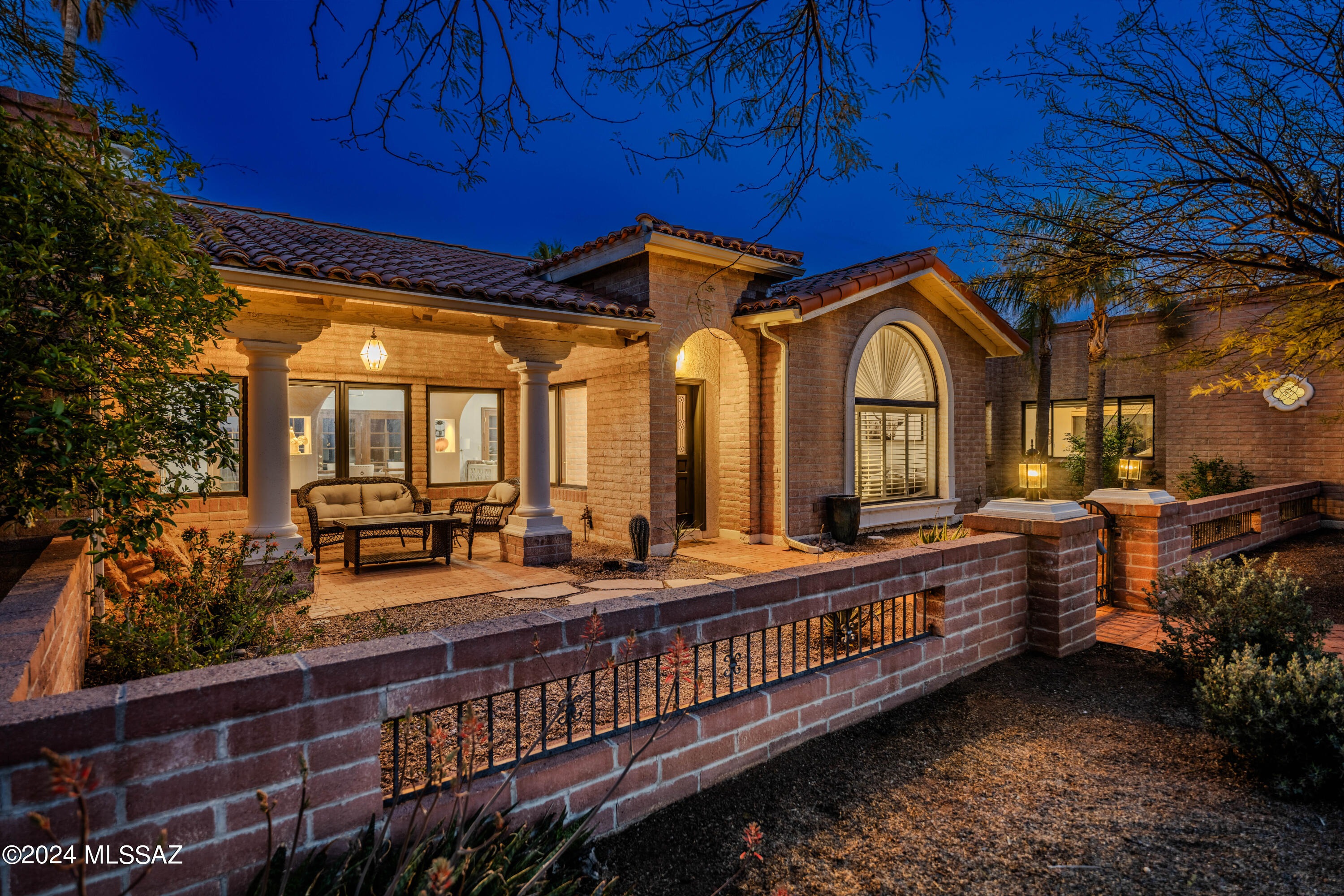 Perched in the foothills of the Catalinas with panoramic views of the Rincon Mountains and city lights, this luxurious home can be all yours. Thoughtfully improved by the current owners, this home is a spacious 4,039 sf with a split bedroom floor plan. An oversized owner's suite leads to a large owner's bath with a garden tub, separate shower and dual vanities. The beautiful dining room is made for entertaining with a vaulted ceiling anchored by a brick fireplace. A gourmet kitchen will satisfy the discerning home chef. 3 additional bedrooms are joined by two full baths and a powder room, plus a rec room adds additional room to enjoy. Endless views greet you in the backyard but there's so much more - see the features list to find out more and come see this one-of-a-kind home today!