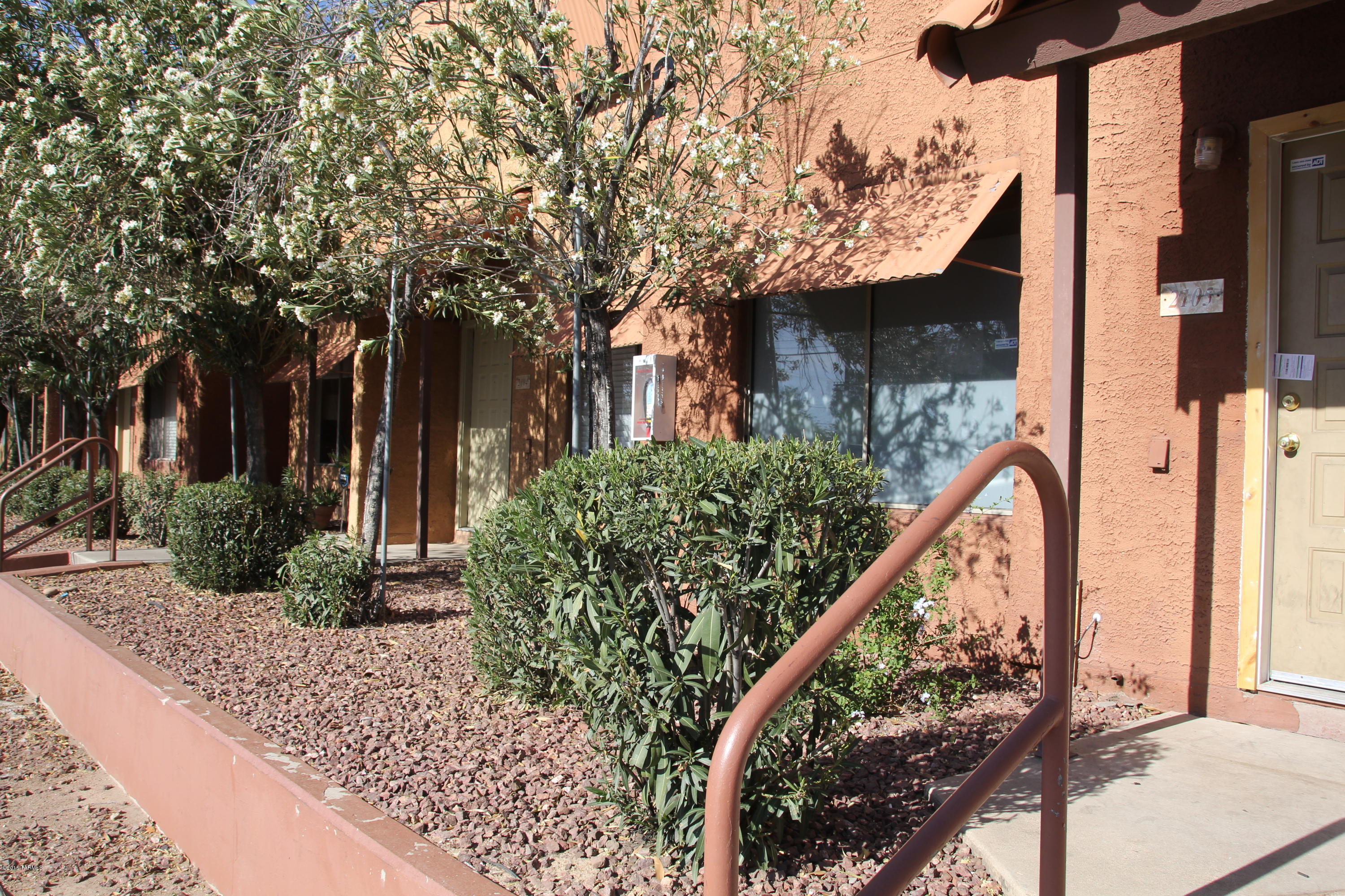 Desert Oasis with updated townhouses priced to sell.  Within the complex, you can find lush grass, high rising palms trees, and a sparkling pool. Another added benefit is the off street, gated and covered parking. There are three different coin operated laundry rooms.