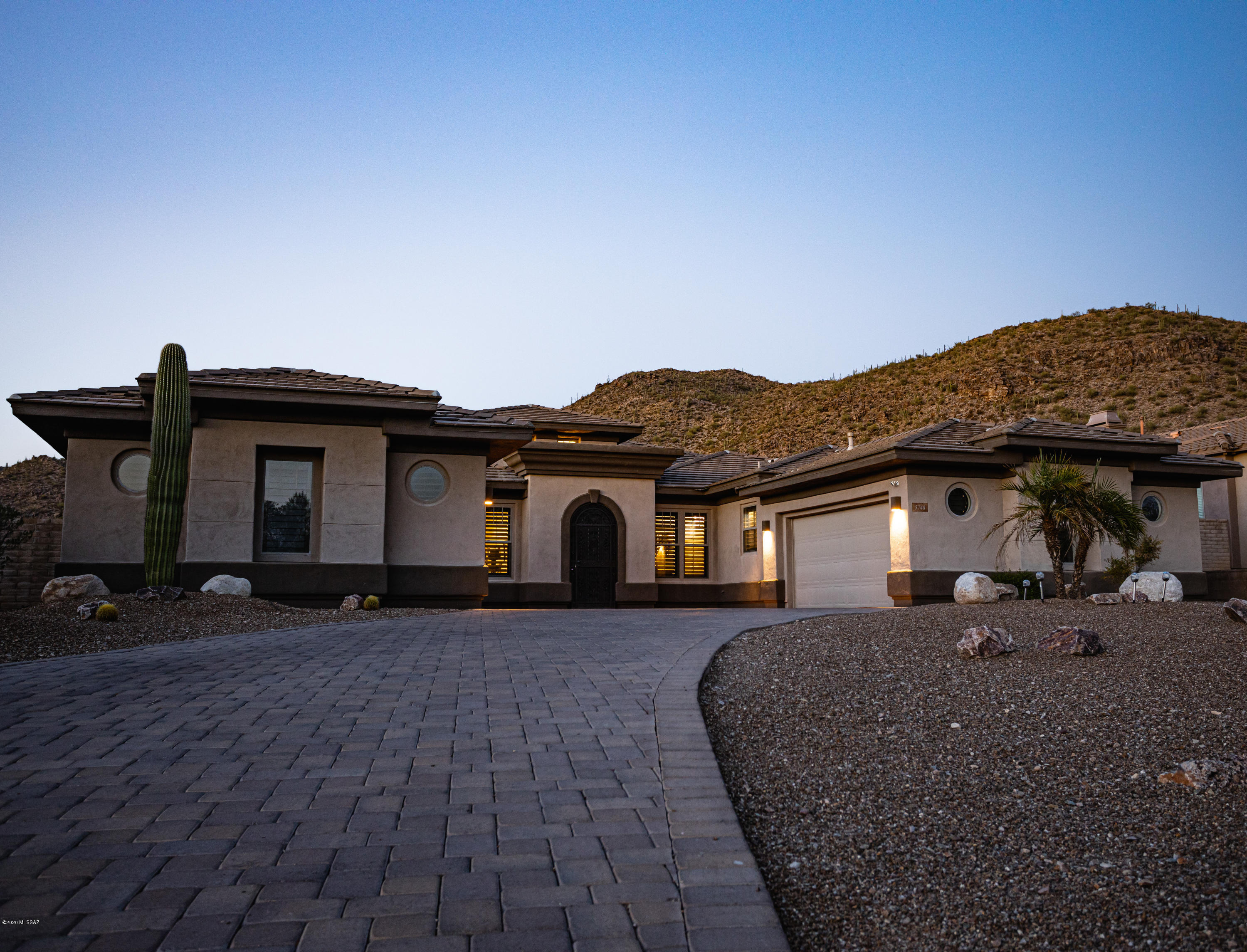 Priced below market value! Don't miss this opportunity to own an absolutely stunning 3BDR (plus study room), 3.5 BR Toll Brothers home located in the prestigious Solana gated neighborhood of Dove Mountain. Home has breathtaking backyard mountain views. Two car garage plus one detached garage. Open living areas with beautiful cherrywood cabinets and matching shutters throughout. Upgraded light fixtures inside. Spacious bedrooms equipped with full shower/bathrooms. Granite countertops in both the kitchen and wet bar. Beautiful and spacious backyard with pool, spa, and outdoor kitchen. Low maintenance landscaping with artificial grass. Located within the Golf Club at Dove Mountain. Must see in person. Schedule your showing anytime!