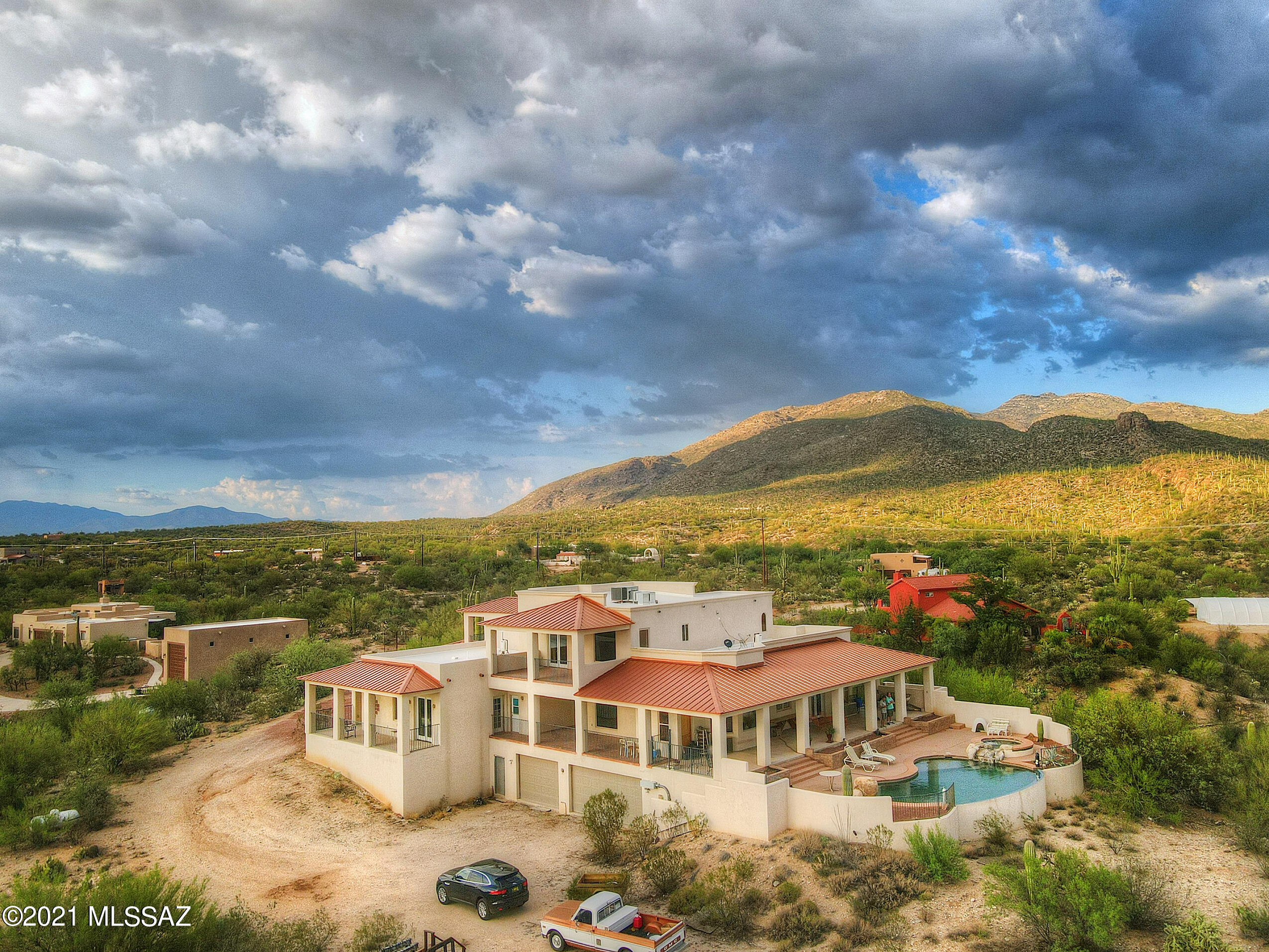 This Beautiful Custom homes sits on 3.3 acres of Horse Property and has 360 degree views of Mountains, city lights, sunsets and sunrises plus a 2500 sq. ft. basement area that includes a media/home theater room and a large attached garage below that can fit up to 6 vehicles. The Home itself is designed and situated perfectly to enjoy everything the property can offer.  With deep wrap around porches and private patios off the bedrooms, you can relax privately or enjoy some great entertaining with your guests. A large Lagoon Style infinity edge pool with spa and waterfall to cool you off.  Inside you will find a true chef's kitchen with red dragon granite counter tops, rich cherry cabinets, double convection ovens, 2 dish washers, warming drawer and more. Master Bedroom and 1 guest room (currently an office) on the first floor and 3 bedrooms with large Loft area upstairs.  Plus a 2500 sq. ft. basement area that includes a media/home theater room.  And a large attached garage below that can fit up to 6 vehicles.   There is also your own Private well, 2 propane tanks. This is truly a must see!!