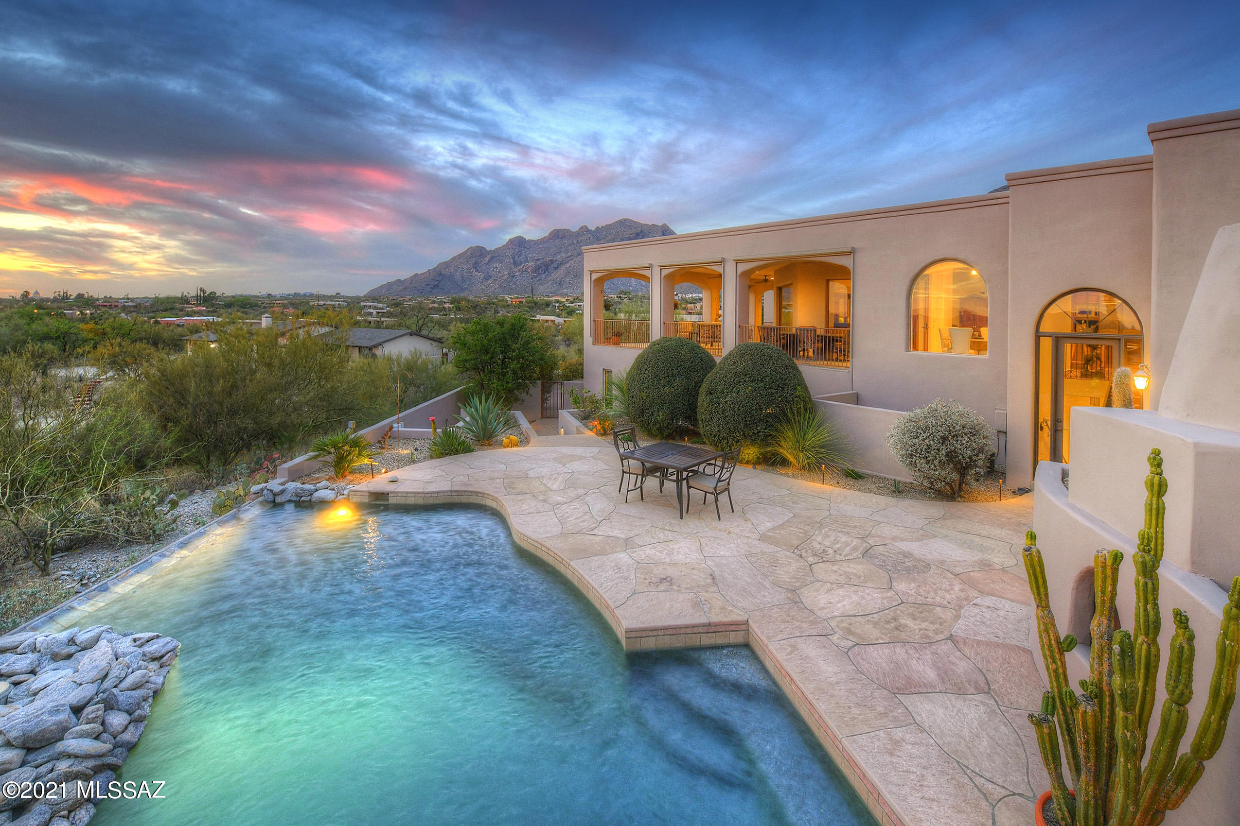 *MAJESTIC MASTERPIECE* RARE FIND!  AMAZING ESTATE - PERCHED ON HILLSIDE IN CATALINA FTHILS #9 BOASTS QUALITY & ELEGANCE! SOLID MASONRY CONST OFFERS VERY VERSATILE FLRPLAN- PERFECT  MULTI- GENERATIONAL, SEVERAL BEDROOM WINGS- ALL *EN-SUITES* + PLUS INCREDIBLE ''PRIVATE'' OFFICE W/ DUAL DESKS, PLENTY OF BUILT INS & GREAT VIEWS! ENJOY TUCSONS OUTDOOR LIVING...RESORT STYLE HEATED POOL, BUBBLING SPA,2 TIERED WATERFALL- ROCK BOULDERS- COVERED OUTDOOR ''AL FRESCO'' KITCHEN- SMOKER, BBQ, EVEN YOUR OWN PIZZA OVEN! UNFORGETABLE VIEWS IN EVERY DIRECTION- WRAP AROUND VERANDAS CREATE A MAGICAL EXPERIENCE...SPARKLING CITY LIGHTS, BRILLIANT SUNSETS MAKE THIS A DREAM LOCATION! BONUS* REC/EXERCISE  RM, WINE CELLAR, TRUE CHEFS KIT- 4 OVENS! LACANCHE RANGE, BUTLERS PANTRY,  **INTERIOR/EXTERIOR JUST PAINTED*