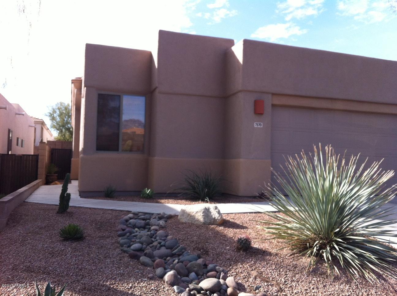 Tanque Verde and Sabino Canyon area just North of Udall Park! Beautiful 3 bdrm, 2 bath home with 1485 sq ft,  A/C & gas fireplace inliving room along with formal dining area. Kitchen has eating area, breakfast bar, smooth top stove, microwave, refrigerator, dishwasher, disposal. Washer & Dryer included. Home features granite counter tops in kitchen and master bedroom bath, Orb hardware & Grohe faucetry, Travertine border tile, quiet close toilet seats, wood framed mirrors, lighted art niches and under cabinet lighting, custom built wall connection for  hdmi patch panel for wall mounted a/v and tv equipment, ceiling fans, double garage with  epoxy coated garage floor, security system available, monthly gardener. Subdivision is gated, has 3 pools and barbecue areas.