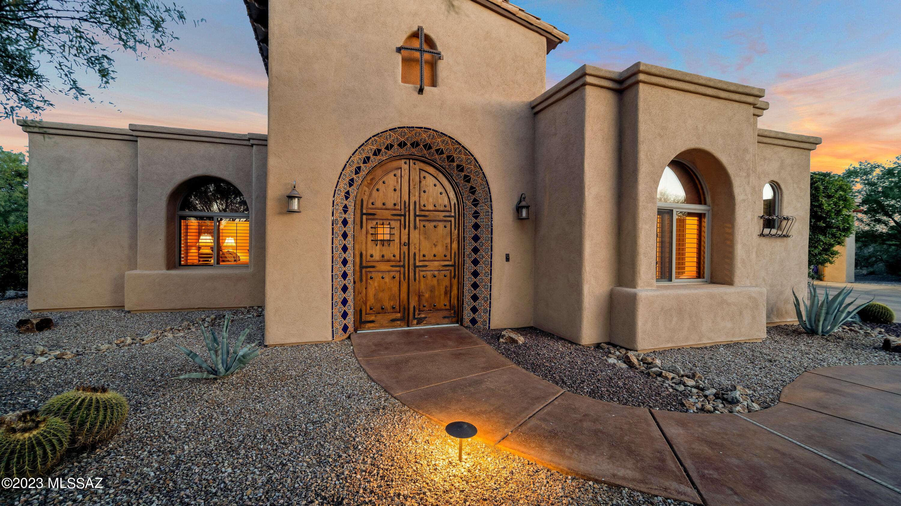 You have found the epitome of SW Luxury! This stunning hacienda-style house is strategically positioned to maximize the picturesque views of the Santa Rita Mountains. A central courtyard welcomes you with its serene ambiance & captivating features. The courtyard boasts a Southwest tiled fireplace, providing a cozy gathering spot. For additional guest accommodations or a private retreat, a casita is nestled on the property. A spacious 3-car garage offers ample storage space for vehicles, equipment, & other belongings. The gourmet kitchen is a chef's dream, equipped with high-end appliances and top-of-the-line finishes. It features a spacious island, a professional-grade gas range, a Sub-Zero refrigerator, & custom cabinetry crafted from the finest materials. Plz expand for more description! An outdoor kitchen awaits, it is equipped with state-of-the-art appliances & ample counter space. It offers a perfect setting for al fresco dining & culinary delights, allowing you to savor meals while enjoying the fresh air and beautiful views. The property features a luxurious pool & spa area, meticulously designed to create a tranquil oasis. The pool is surrounded by a spacious deck with lounge chairs & umbrella, providing a perfect spot for sunbathing & relaxation. The spa offers a rejuvenating retreat, allowing you to unwind & soak away the stresses of the day. Inside the house, a spacious family media room awaits, providing a comfortable & inviting space for entertainment & relaxation. The family/media room is equipped with state-of-the-art audiovisual equipment, including a large-screen television & surround sound system, creating an immersive cinematic experience for family movie nights or watching sports events. A dedicated office or den space offers a private retreat for work, study, or relaxation. The office features elegant built-in bookshelves, a desk with ample workspace, & comfortable seating. The large window provides natural light & offers views of the surrounding landscape, fostering a productive and inspiring environment. Perched atop the residence, an observatory deck provides a panoramic view of the Santa Rita Mountains. This elevated platform allows you to immerse yourself in the beauty of the surrounding natural landscape and enjoy stargazing or simply taking in the stunning vistas. EZ Water system, dual HVAC Zoning, Casita has a Mini Split. This lavish Santa Barbara Ranch Style home is truly a treasure in Green Valley!