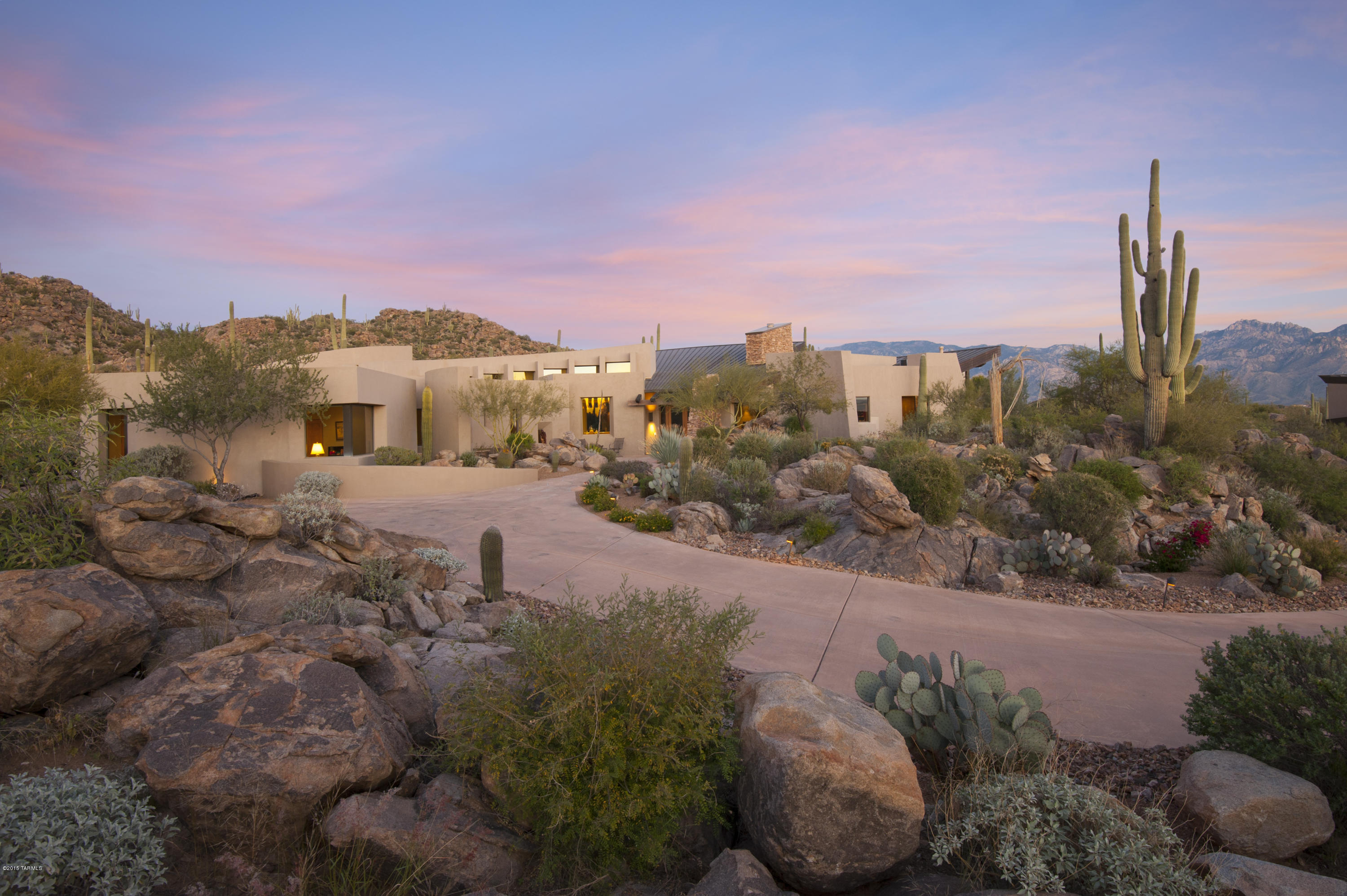 Located on the finest street in Stone Canyon on a beautiful saguaro studded lot with backyard facing the Santa Catalina Mountains.  Amazing views of the mountains and sunsets that are protected forever. One of the first homes built in Stone Canyon. Kevin Howard designed custom home. On the golf with views from every window  yet private and secluded.  You have to come inside to appreciate! Clearly this home was designed to incorporate the inside with outside living. Stunning great room with walls windows revealing the magnificent desert beauty. 
This home offers a split bedroom plan plus an office   with a private bath and entrance. Two car garage, originally 3 car third bay was converted to add'l room.
Sports Membership required with every purchase.