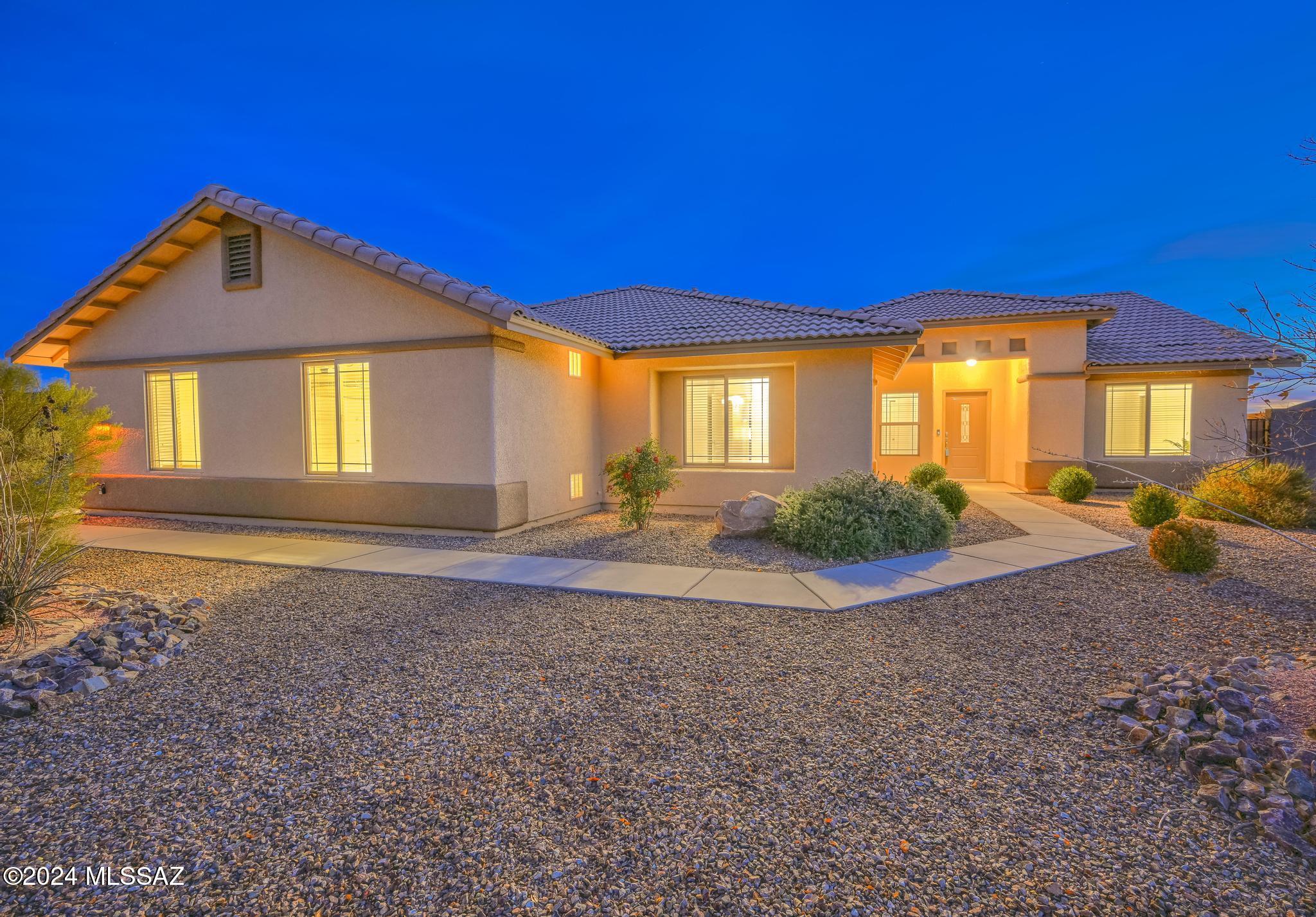 Stunning 4 bedroom, 2 bath home in Kings Ranch with resort-style outdoor living space featuring a custom built pool and spa with two fountains! This immaculate home boasts a spacious great room design, luxurious kitchen with granite countertops, rich wood cabinetry, and stainless steel appliances. 9' ceilings with a huge master suite to include a custom walk-in shower and closet. The front bedroom features double glass doors and could be used as an office or den. Step outside to an oasis and great entertaining space featuring covered patio, louvered pergola and expansive sparkling pool.  Time to relax in the raised spa and enjoy those panoramic mountain views! Fully fenced backyard with RV gate and 3 car side entry garage that provides ample space for vehicles or toys. Must see home!