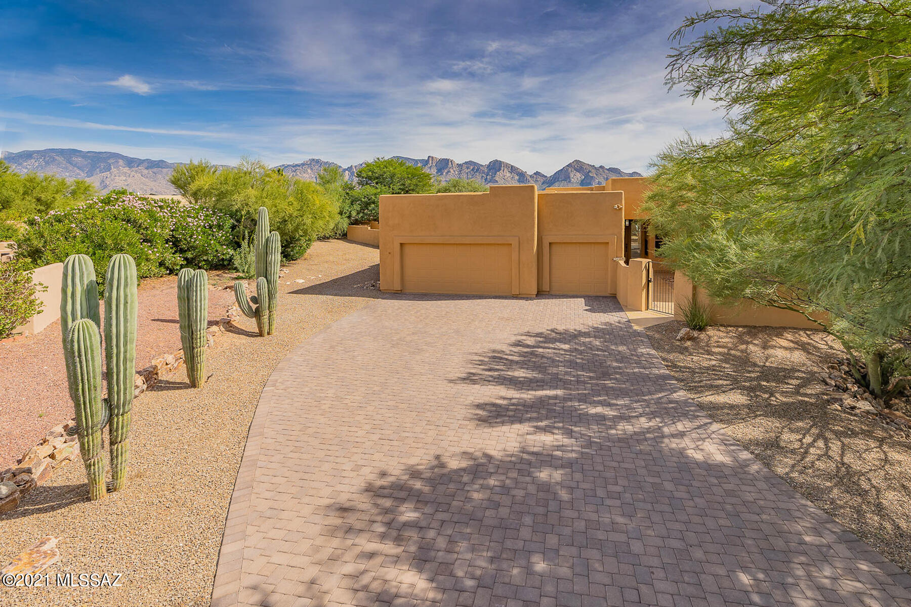 Highly updated 4BD/3BA (3,165 sq ft) home in the heart of Oro Valley sits on a half acre cul-de-sac lot w/ brick paver driveway, gated front courtyard and East facing views. New dual zoned HVAC, water heater, carpeting and interior/exterior paint. Enter to find a large formal living space boasting triple patio doors with spectacular Pusch Ridge views. Expansive Great room hosts a central gourmet kitchen with SS appliances, granite counters, island and built-in media wall. Private master suite hosts dual vanities w/ granite tops, soaking tub, walk-in shower and huge walk-in closet. Guest room offers en suite bath. Two additional bedrooms plus hall bath w/ shower. Retreat to the expansive rear yard with covered patio; sparkling, gated pool w/ banco seating and breathtaking views!