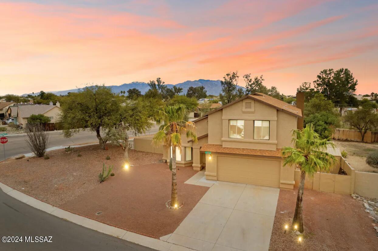 Immaculate 5 star 5 bedroom 3 bath home in a popular Northwest neighborhood. Meticulously maintained home exudes luxury. Large tile throughout  the bottom floor adds a smooth richness. Kitchen  features a richly dolomite counters with movement lade adorned by imposing grey/black veins of varying thickness, a beautiful blend and Stainless Steel Appliances. The family room fireplace adds style and warmth. Master suite offers a sense of grandeur with a high vaulted ceiling, an office private deck overlooking the backyard. Master bath offers dual sinks, garden tub, a shower with an eye-catching floor to ceiling tile design. Step out to a generous size backyard, covered patio. Backs up to Clubhouse. (cccanews.com/our-amenities/) close to schools, I10, golf, movies and shopping.