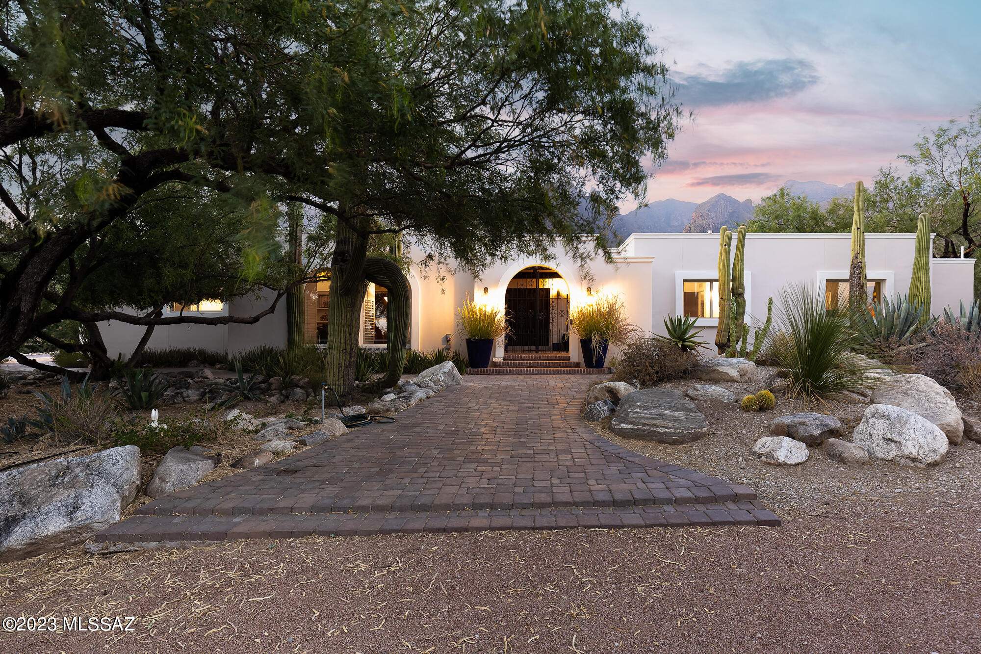 Located in the highly desirable Coronado Foothills Estates, this 3,499 Sq Ft home features 4 bedrooms and 4 bathrooms. Sitting clandestinely in the center of the Catalina Foothills, the panoramic Santa Catalina Mountain views are prominently featured with Finger Rock framed immaculately from the backyard. The backyard is surrounded by serene desert landscape & features resort-style amenities that provide perfect relaxation & entertainment options: pool, a private patio, built-in BBQ, and dining space under the sizable covered patio.

The primary suite is positioned with direct access to the backyard and is its own large retreat with over 375 Sq Ft of space and an ensuite primary bathroom and large walk-in closet from California Closets. A private courtyard provides a serene setting and prompt access to the backyard and pool.

Just off the kitchen, is a guest bedroom with an adjacent bathroom with shower. Two additional guest bedrooms sit on the east side of the home, creating a guest wing with an ensuite bedroom and additional hall bathroom.

The kitchen and living room are well thought out for both entertainment and intimate family gatherings. Gas cooktop and stainless steel appliances complement the cook's kitchen. Foothills character and details are seen throughout. The kitchen has a myriad of options for entertainment and family gatherings, with a large light filled casual dining space, large island and eat-in kitchen highlighted by a wet bar with drawer dishwasher, wine cooler, and countertop space for bar or food service.

The home is in a non-HOA community (Voluntary) with phenomenal location with District 16 schools, close proximity to La Encantada, La Paloma Country Club and easy access to Oro Valley, Downtown and beyond. Countless details and character throughout with a high level of maintenance. 3-car garage, immense amounts of additional storage and flat driveway with guest parking spaces.

Living in the Catalina Foothills of Arizona offers several advantages that make it a desirable place to reside. Here are some reasons why it is considered great to live in the Catalina Foothills:

Natural Beauty: The Catalina Foothills is nestled against the stunning Santa Catalina Mountains, offering breathtaking views and a picturesque setting. Residents can enjoy the rugged desert landscape, with its distinctive saguaro cacti, diverse wildlife, and miles of hiking trails.

Pleasant Climate: The region benefits from a warm desert climate, characterized by mild winters and hot summers. The Catalina Foothills enjoy approximately 350 days of sunshine each year, making it ideal for outdoor activities like golfing, biking, and hiking.

High-Quality Living: The Catalina Foothills is known for its upscale residential neighborhoods, boasting luxurious homes, gated communities, and beautiful desert estates. The area is renowned for its high standard of living, offering residents a comfortable and prestigious lifestyle.

Excellent Education: The Catalina Foothills School District is highly regarded for its top-rated public schools, known for their academic excellence and comprehensive programs. Families with children can benefit from the exceptional educational opportunities available in the area.

Outdoor Recreation: The Catalina Foothills provides abundant opportunities for outdoor recreation. Residents can explore Sabino Canyon, a popular destination for hiking, picnicking, and enjoying the natural beauty of the Sonoran Desert. The nearby Coronado National Forest also offers various recreational activities, such as camping, fishing, and wildlife viewing.

Cultural Attractions: The Catalina Foothills is located just a short drive away from the vibrant city of Tucson, which offers a rich cultural scene. Residents can enjoy diverse dining options, world-class museums, art galleries, theaters, music festivals, and other cultural events.

Health and Wellness: The Catalina Foothills is home to several prestigious resorts and spas that offer luxurious wellness retreats and rejuvenating experiences. Additionally, the region has access to quality healthcare facilities and medical services.

Proximity to Amenities: While living in the Catalina Foothills provides a sense of serenity and seclusion, it is still conveniently located near essential amenities. Residents have easy access to shopping centers, grocery stores, restaurants, entertainment venues, and other necessary services.

Golfing Paradise: Golf enthusiasts will find themselves in paradise in the Catalina Foothills. The area boasts numerous world-class golf courses, including the renowned Ventana Canyon Golf and Racquet Club and the Omni Tucson National Resort, offering stunning courses and scenic views.

Community Spirit: The Catalina Foothills fosters a strong sense of community and neighborly camaraderie. Residents often engage in community events, social activities, and local organizations, creating a warm and welcoming atmosphere.

These factors contribute to the overall appeal of living in the Catalina Foothills, making it an excellent choice for those seeking a beautiful, upscale, and active desert lifestyle.