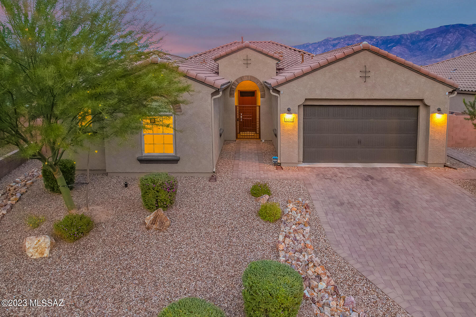 Panoramic Catalina Mountain Views!  This highly upgraded, east facing 3BD/2.5BA + Den (2,346 SqFt)  home back up to natural land to maximize the view & privacy. No neighbors behind! Seller owned solar. Open concept floorplan, custom paint & tile floors throughout (no carpet).  Gourmet kitchen hosts a large island, SS appliances, walk-in pantry, breakfast bar and dining area. Luxurious Owner's Suite boasts Bay Windows to capture the views, patio access, dual sinks vanity, large walk-in shower and closet.  Spacious Guest Rooms with Jack-n-Jill bathroom. Office/Den can serve as 4BD.  Enjoy the unobstructed mountain view in the private backyard with covered/uncovered patios, built in BBQ, firepit, & turf.  Oversized lot with plenty of room to add a pool. A must see. Views!