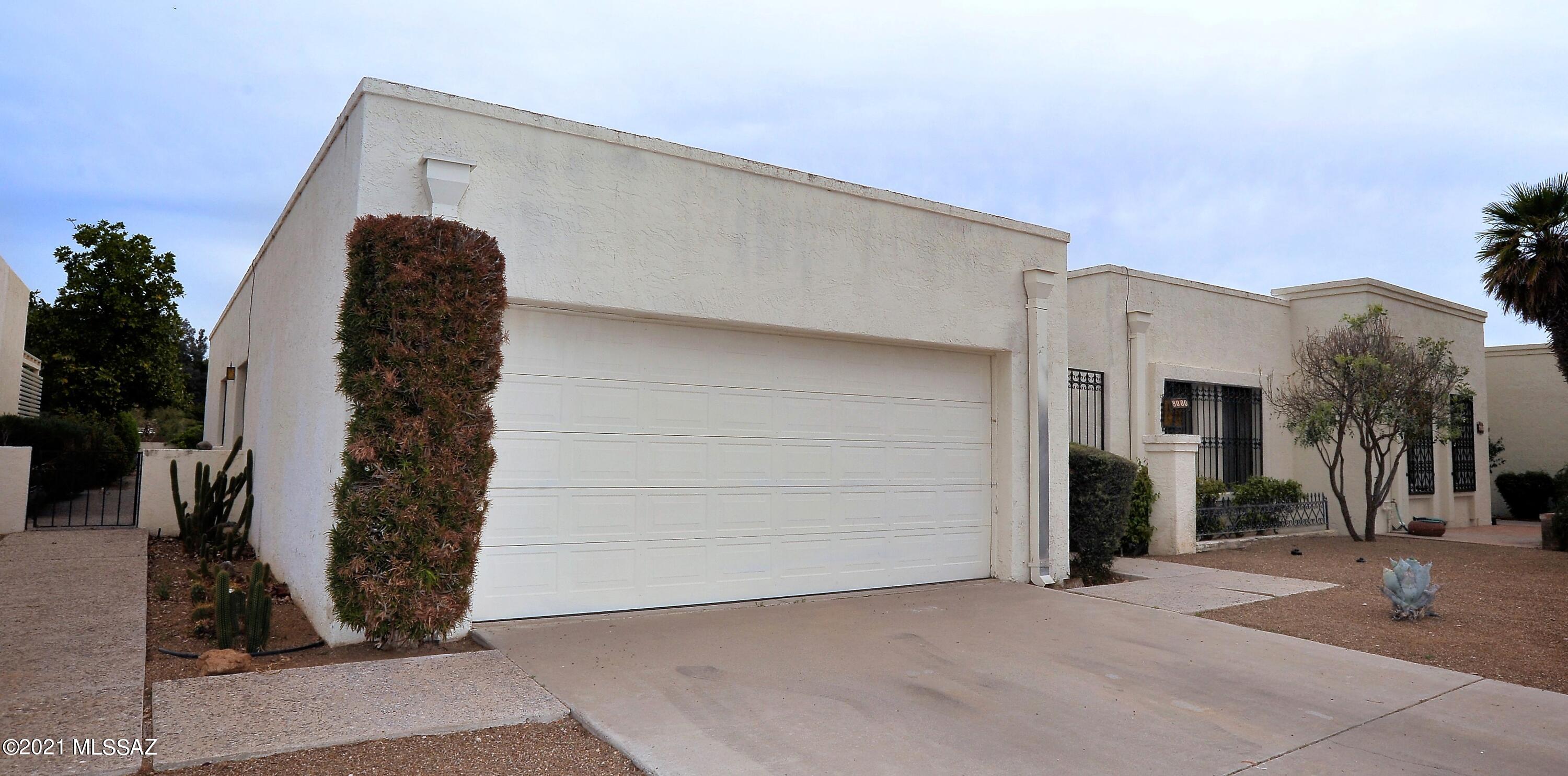 Gorgeous Catalina Views with Resort Living accent this Omni Tucson National Golf Course home. Separated from the fairway by a wide wash giving you plenty of privacy. Sit and relax in the beautiful Arizona Room with your own beehive fireplace. Plenty of room for entertaining in the grand open living and dining rooms! Bright and cheery kitchen features its own breakfast area with sliding doors to yet another patio. Well sought after gated community close to shopping and amenities. A prestigious Tucson Active Adult Community. Home needs upgrading and TLC. Great opportunity and price for someone ready to do the work!