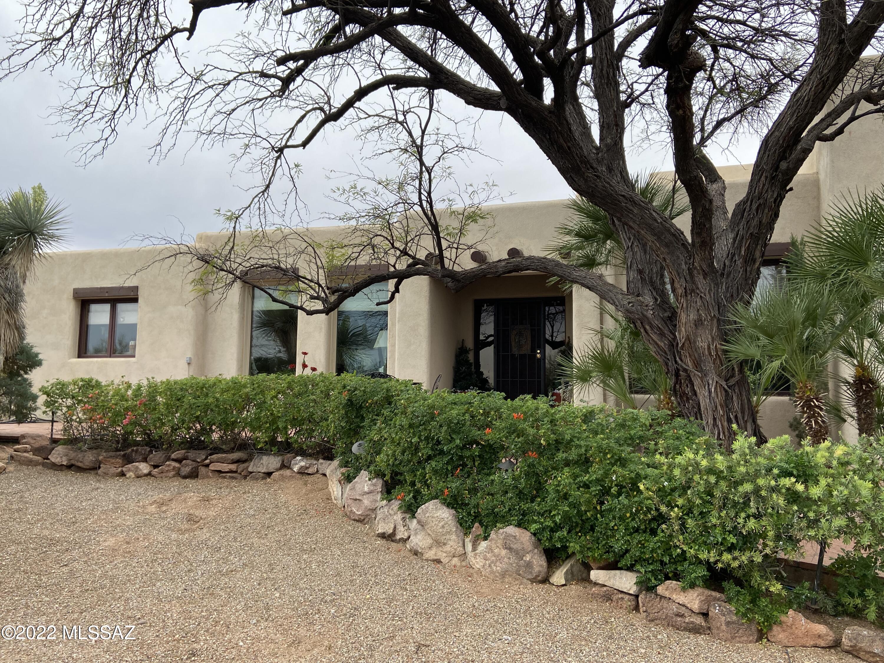 Custom home nestled on 4.98 acres with Four Bedrooms and Three Bathrooms. Spacious kitchen with plenty of cabinets and counter space. Two wood burning fireplaces. Exterior features; pebble tech pool, mature vegetation, large covered patios and a balcony off master bedroom with views in all directions. Two car garage. Call today for a private showing.