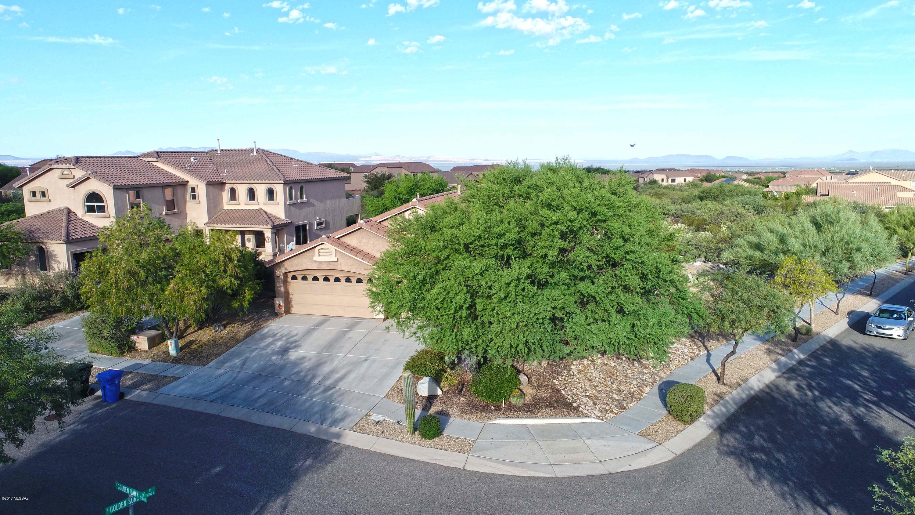 Highly upgraded home in Sycamore Canyon in the heart of the Santa Rita Foothills. This premier location has views for miles with private secluded yard.  Premium granite countertops in all wet areas. 3 car garage and large open kitchen with huge island. Laundry room has a counter and sink. Custom features throughout. View fencing with superior lot placement. Mature vegetation with shade and fruit trees. Community pool/spa, park, sport court included in HOA.