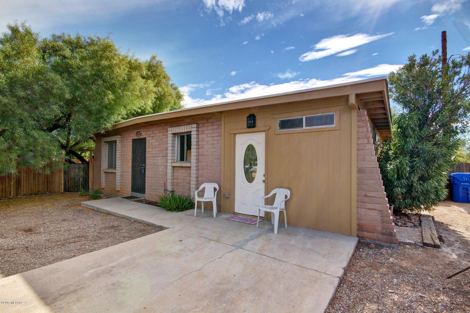 Charming Vintage Home newly updated & centrally located! Close to bike paths, shopping, entertainment & UofA. Home has tons of character and design elements. Plenty of natural light throughout, Great shelving in family room, ceiling fans throughout, neutral tile floor, and plush carpet in the bedrooms. Newly Updated & spacious retro kitchen features SS/black appliances, tiled counters/backsplash,  and white wood cabinetry with hardware. Great gathering place for family and friends! Huge interior laundry room. Fun & unique tiled bathrooms, generous size bedrooms, ample closets, & French doors to Bonus room/AZ room that has endless possibilities. HUGE backyard on 1/3 of an Acre is a blank canvas for your future entertaining! Roof just had new coating-2017, fresh interior paint. Welcome Home!