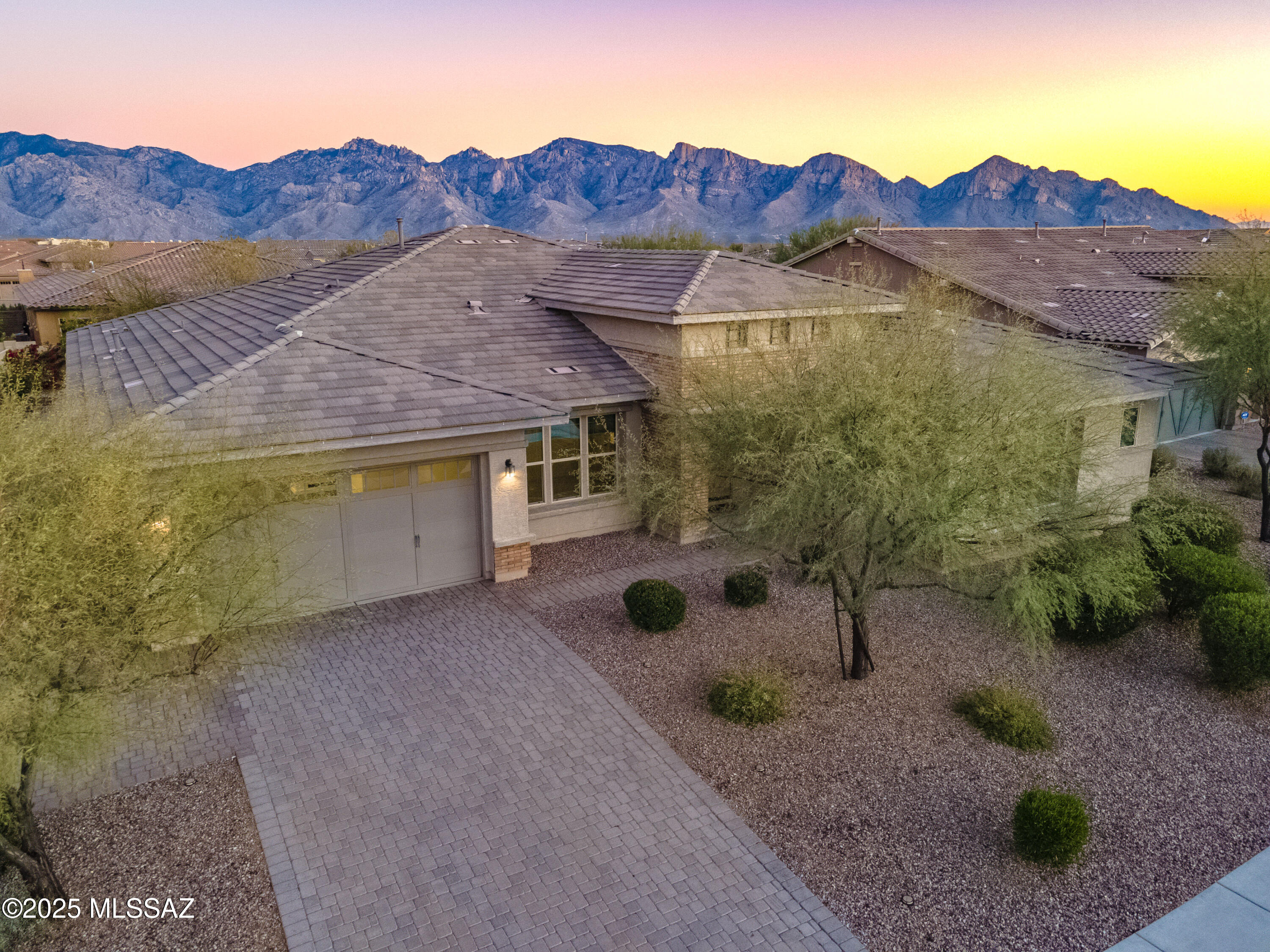 Gorgeous 3,717 SQFT 4 BR/ 3.5 BA home w/ two bonus RMs at a large lot in The Pinnacle of Center Pointe Vistoso (CPV). Nestled in the heart of Rancho Vistoso.  CPV gated community offers a gated Olympic-size pool, interactive splash park, with adjoining BBQ grill and a fire place seating area ,a covered Ramada's with picnic tables and a playground.  The house entrance is finished with a brick paver drive and soaring stacked stone with 3 car tandem garage. The home is an entertainer's delight with a generous central great room. The interior features 10 ft soaring ceilings, beautiful ceramic tile, chef's kitchen with 11ft island with breakfast bar, Double Ovens, breakfast nook, formal dining room, office/den, Bonus rm can be 5th BR. Brand new carpets. Seller spent about $40,000 in the backyard with the professional design. The backyard with a Playground set, Fruits trees and garden beds to grow the vegetable.  Spacious side yard with a lot of storage areas. All Walk- in closets.  Many storage. A Must See