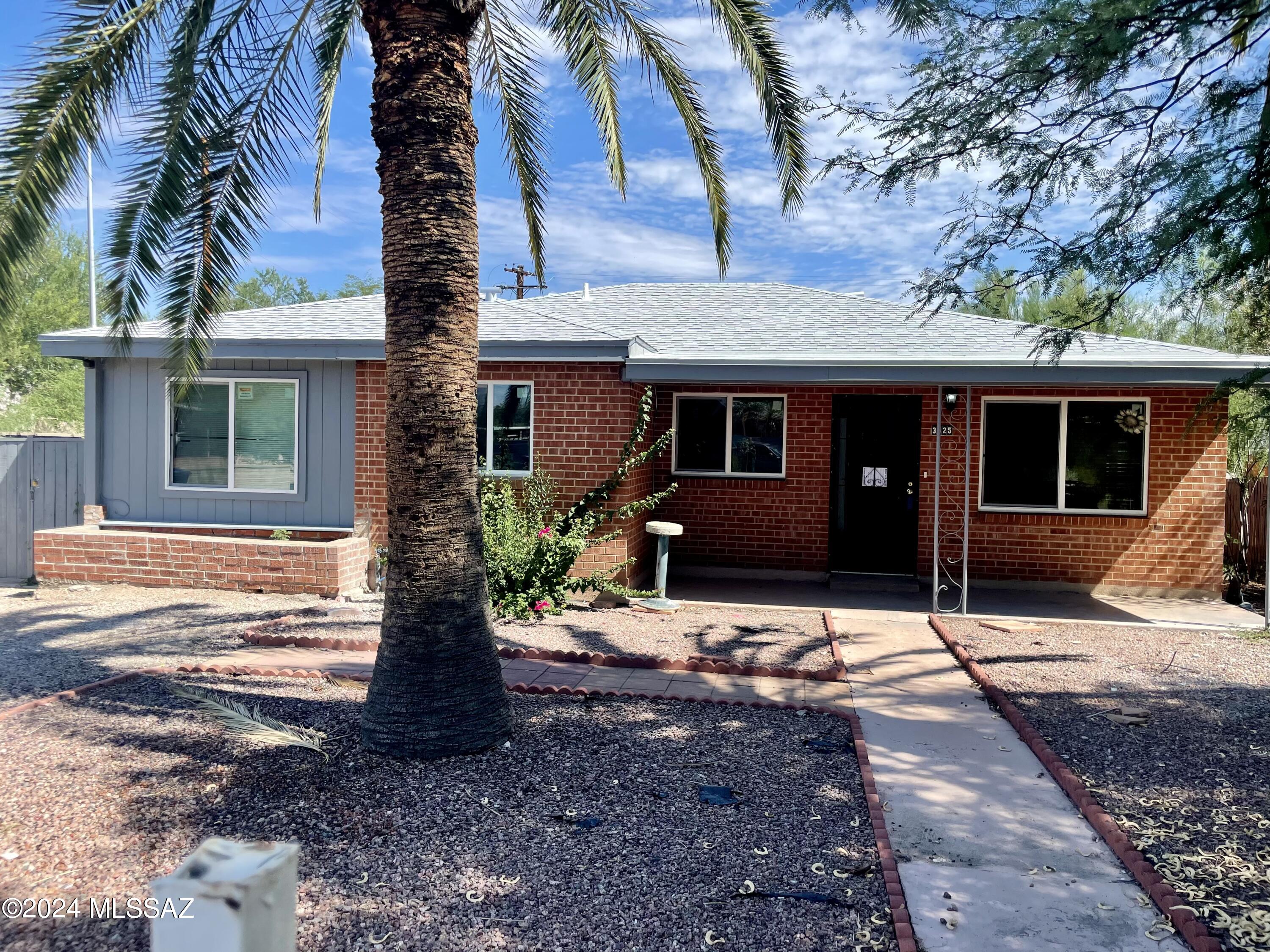 This lovely recently renovated brick home boasts plenty of light and storage space. With a shed in the back to add additional storage and a permitted additional bathroom you can't go wrong! This home is close to the University of Arizona as well as many shops, restaurants, and bus lines. Section 8 accepted.