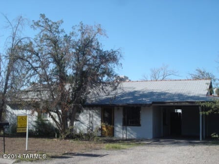 Charming 3 bedroom home in convenient, central location.  Features living room, dining area, separate family room, large backyard and additional storage are off of carport.