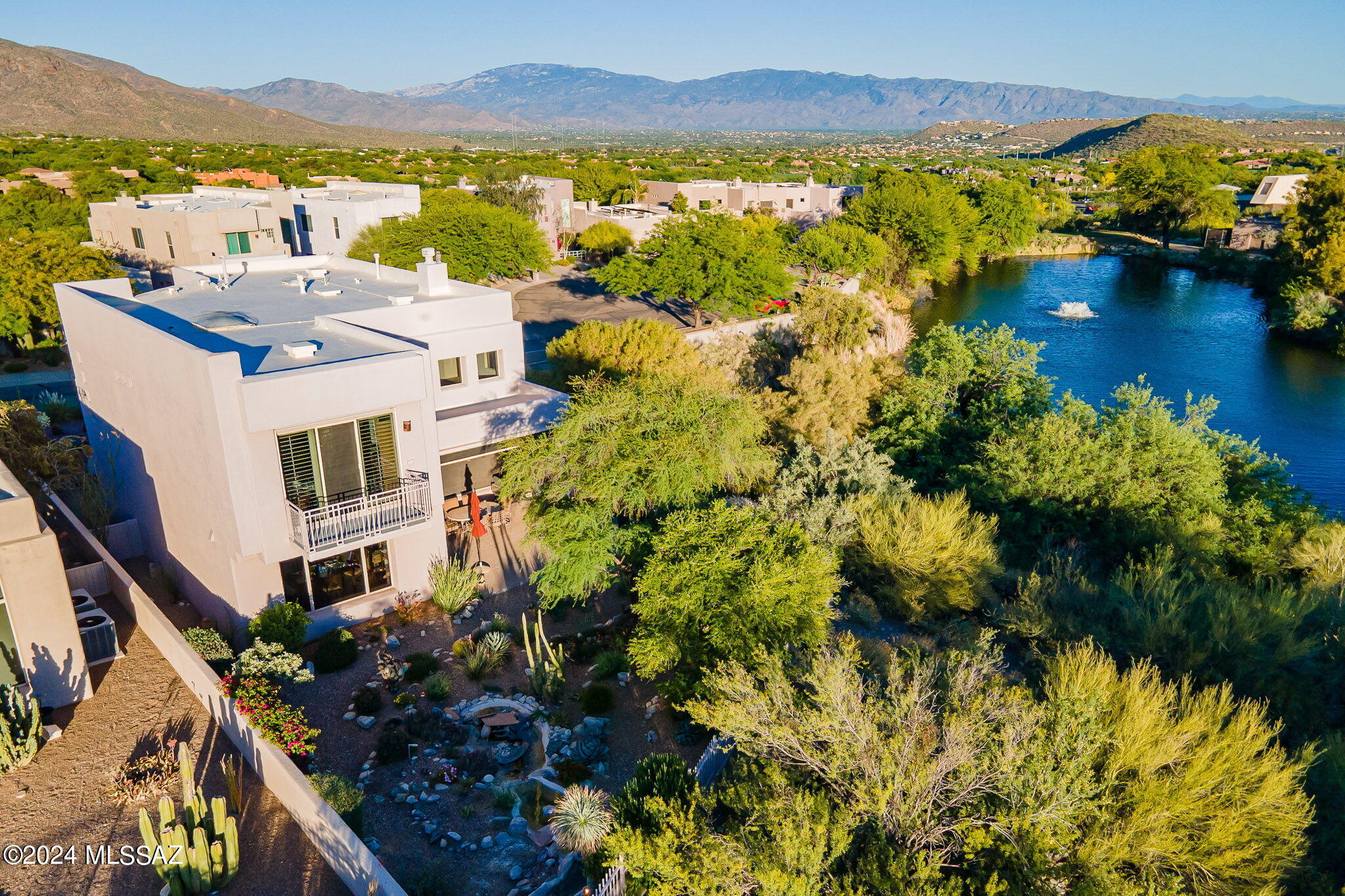 Coveted Location & Low Maintenance Living in This 3BR/3BA (w/Office) Masonry Built Home on Premium End Lot Overlooking The Ventana Canyon Golf Course (12th Fairway) & Lake. Spectacular Sunset, Mountain, & City Views. Fine Features Include High Ceilings, Oversized Windows, Plantation Shutters, Open Living & Dining Areas, Office w/ Built in Cabinetry and Desks, Island Kitchen w/ Granite Counters, Stainless Appliances, Gas Range, & Breakfast Area + Bar. Upstairs Features 3 Bedrooms Including Primary Suite w/ Golf, Lake, & Mountain Views, Private Balcony & Bath w/Separate Tub & Shower, Double Vanities & Walk in Closet. Up Stairs Laundry w/ Washer and Dryer.  Private Backyard w/ Sunset Views, Covered Patio, Spectacular Landscaping Including Natural Looking Water Feature Pond/Stream. Must See!