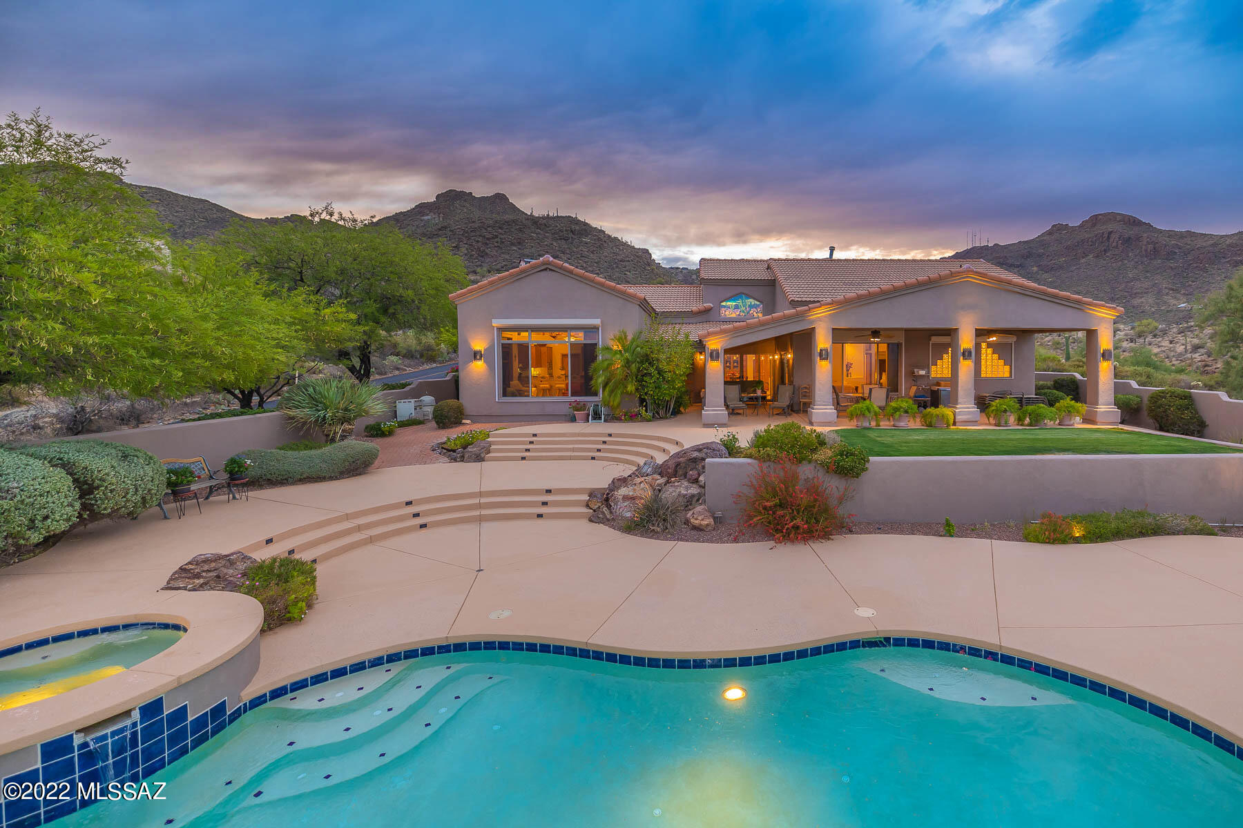 Magnificent drive up to one of the most spectacular canyons above West Tucson gives way to a striking, custom home in prestigious gated Trails End Estates. STUNNING views of the city lights, mountains, canyon walls and Sonoran Desert. Spacious living areas with soaring high ceilings. Gourmet island kitchen with custom cedar wood cabinetry, granite counters and high end appliances. Luxurious bathrooms. Custom dual pane windows. Solid cedar doors. Beautiful 16'' Quarry tile floors. Separate library & sitting rooms. Custom built-ins. No interior steps. Resort like outdoor living w/refreshing pool, waterfall, BBQ, desert landscaping & amazing views! See Custom Features in attached documents, floor plan & 3D Scan. Home is exempt from HOA dues! See agent only remarks for offer requirements. HVAC units have been inspected and certified by 2-10 HBW.