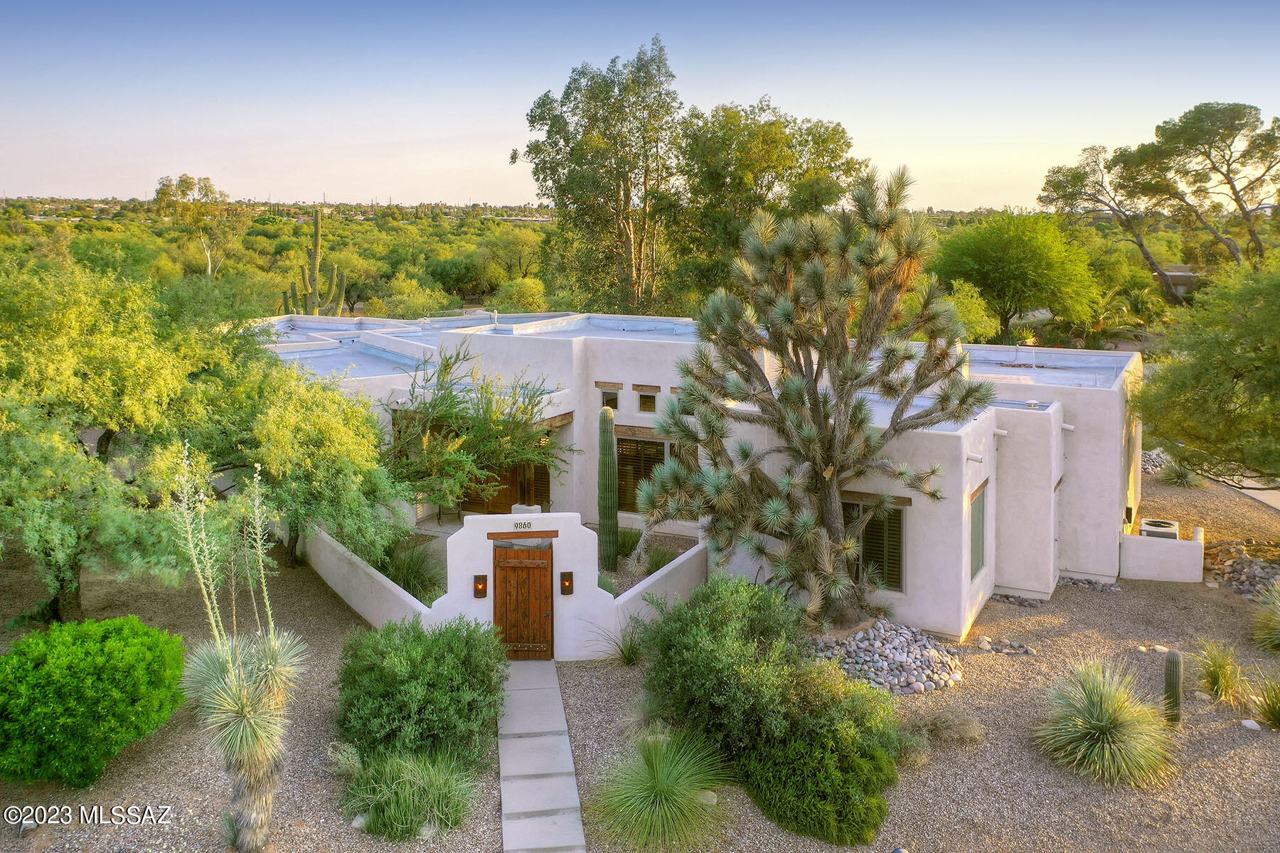 Courtyard Entry to Custom Sante Fe home w beamed ceilings,clerestory windows & beehive fireplaces on private corner
lot adjacent to Isabella Lee Natural Preserve. Roomy kitchen, breakfast  & entertainment area in Great Room. Living & dining  feature beehive fireplace &
opens to mature garden setting. Primary bdrm w fireplace, spacious bath & closet. Expansive covered patio,professionally
landscaped backyard w brick pavers, Mt view & room to relax or entertain. Home features high ceilings, Anderson windows,
plantation shutters, niches, a flowing floor plan, 18''tile throughout & walk in closets in all bdrms w plenty of storage. Exceptional oversized 3 car garage w extra height, epoxy floor & 3 storage rooms! Perfect garage for a car enthusiast or a workshop.Original blueprints convey w property. Private enclave of 20 homes in neighborhood. Welcome home.
Anderson windows except sliding glass doors, side lights at front door and upper clerestory windows.