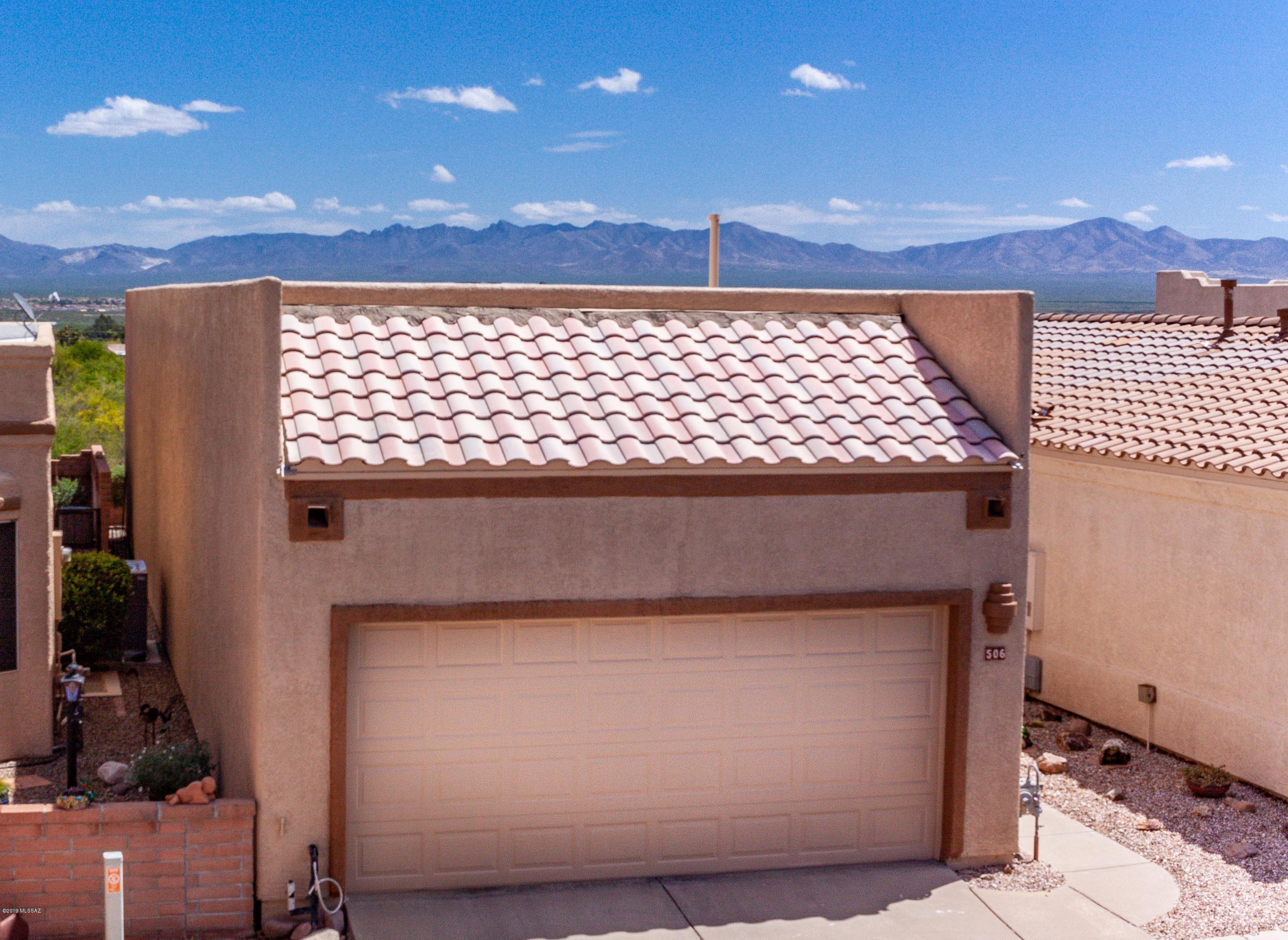 Spectacular Panoramic Mountain Views greet you the moment you step into this freestanding home in a very private setting. Many recent updates including  exterior and interior painting throughout, new Corian Countertops, new kitchen faucet, disposal, dishwasher, Refrigerator, lighting, water filter system & Ceiling fans. New low maintenance  landscaping in front and backyards. Roof re-coated in 2017 and new HVAC & Water heater in 2016. Storage cabinets in great room and garage.  NO GVR but is available if a buyer chooses.  You'll love this magnificent Green Valley home and setting, and just a very short walk to the pool.