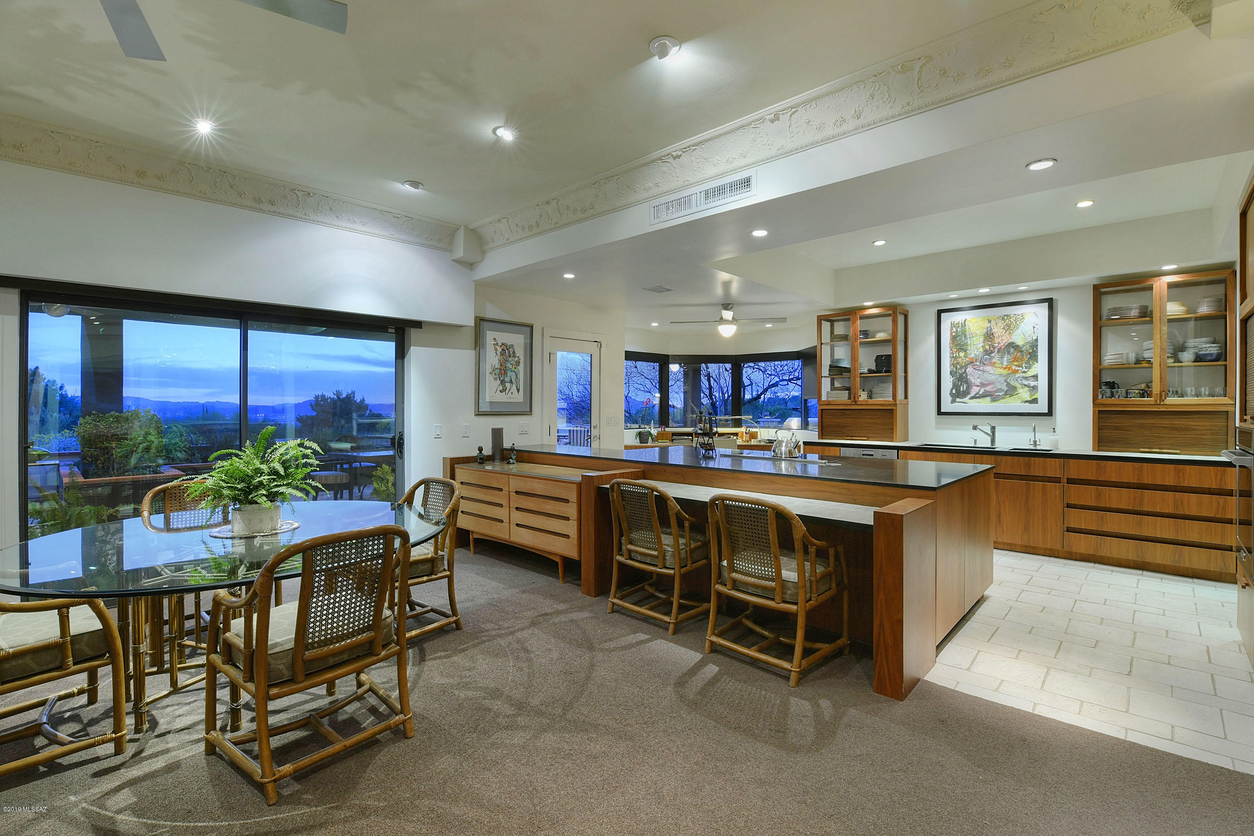 Mid-Century meets Modern Contemporary with an elegance that will enthrall your pickiest buyer.  3bed+Den/4bath, single story, 3749 sq ft & Fully updated with an artist's eye. French Oak Floors, Organic Wool Carpet, High custom plaster ''museum'' ceilings, designer kitchen w/American Black Walnut Custom Cabinets, Huge Master bedroom with fireplace, built-ins,sitting area, large Master bath w/dual sinks, shower & walk in closet.  Bedroom #2 is like a 2nd master w/ensuite bath and its own private patio. Outside, aprox 2000 sq feet of entertainment areas w/courtyard & back yard covered patio w/travertine pavers.  All of this situated on a 1.12 acre lot w/room to add, adjacent to the golf course with outstanding Views of Golf Course, the City Lights & Catalina Mountains. A true GEM