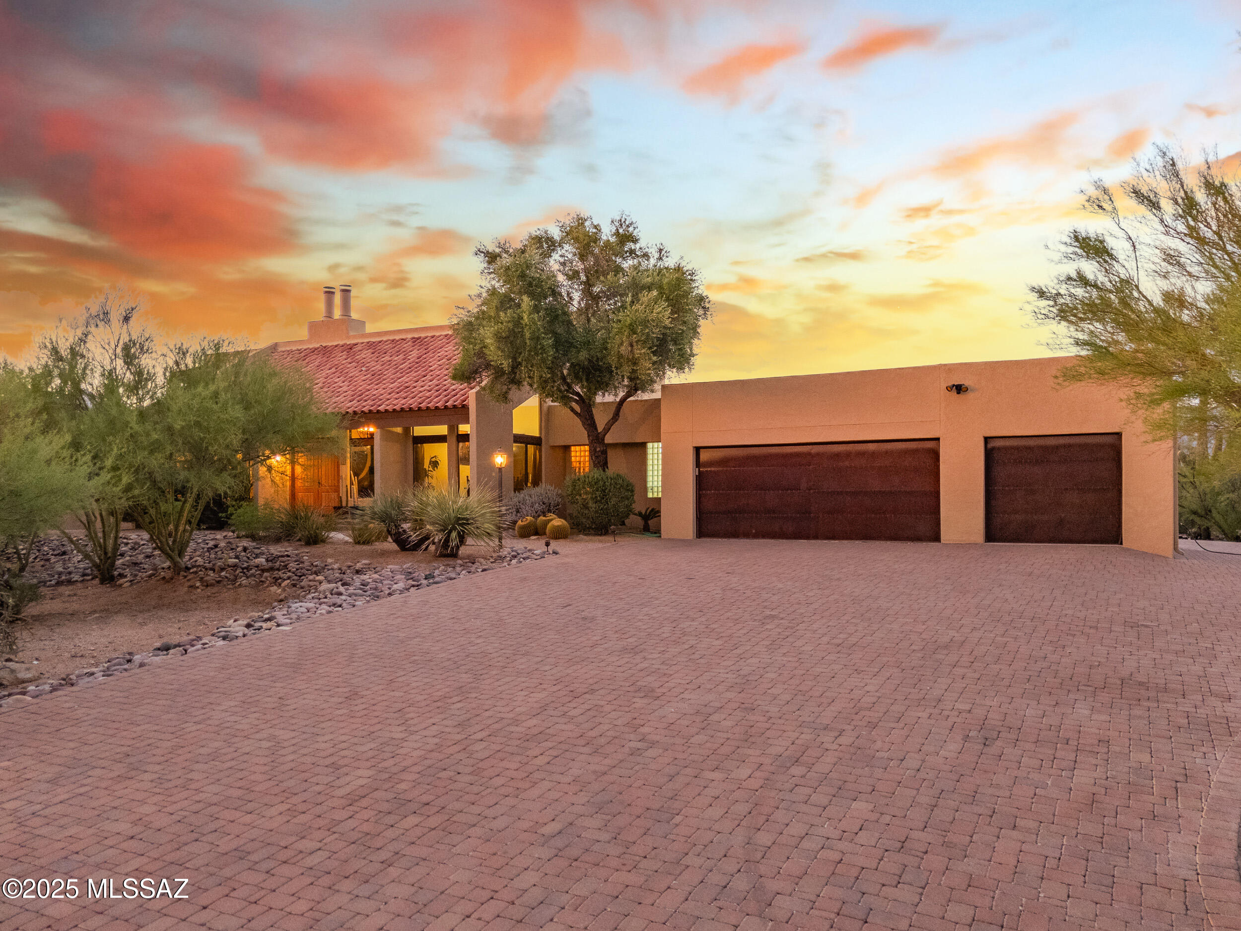 Enjoy breathtaking mountain views and unmatched privacy on over 3.5 acres with this beautifully designed custom home. Vaulted ceilings with exposed wood beams create a warm, open feel, complemented by two inviting wood-burning fireplaces in each living area. The home features two balconies, a spacious 3-car garage with abundant storage, and an Arizona room that leads to a fresh-water pool with sand filter, built-in BBQ, and seating area—perfect for entertaining. A rare desert retreat blending comfort, space, and natural beauty.