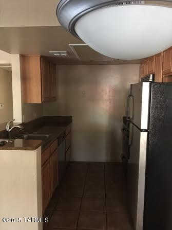 Downstairs 2 bedroom/2 bath unit-Granite kitchen w/stainless steel appliances, wood burning fireplace in the living room. Community pool, spa, fitness center & tennis courts plus hiking and biking trails nearby. Water and trash included-tenants pay electric. Close to Pima College West Campus and easy access to I-10, downtown, U.M.C. & U of A.