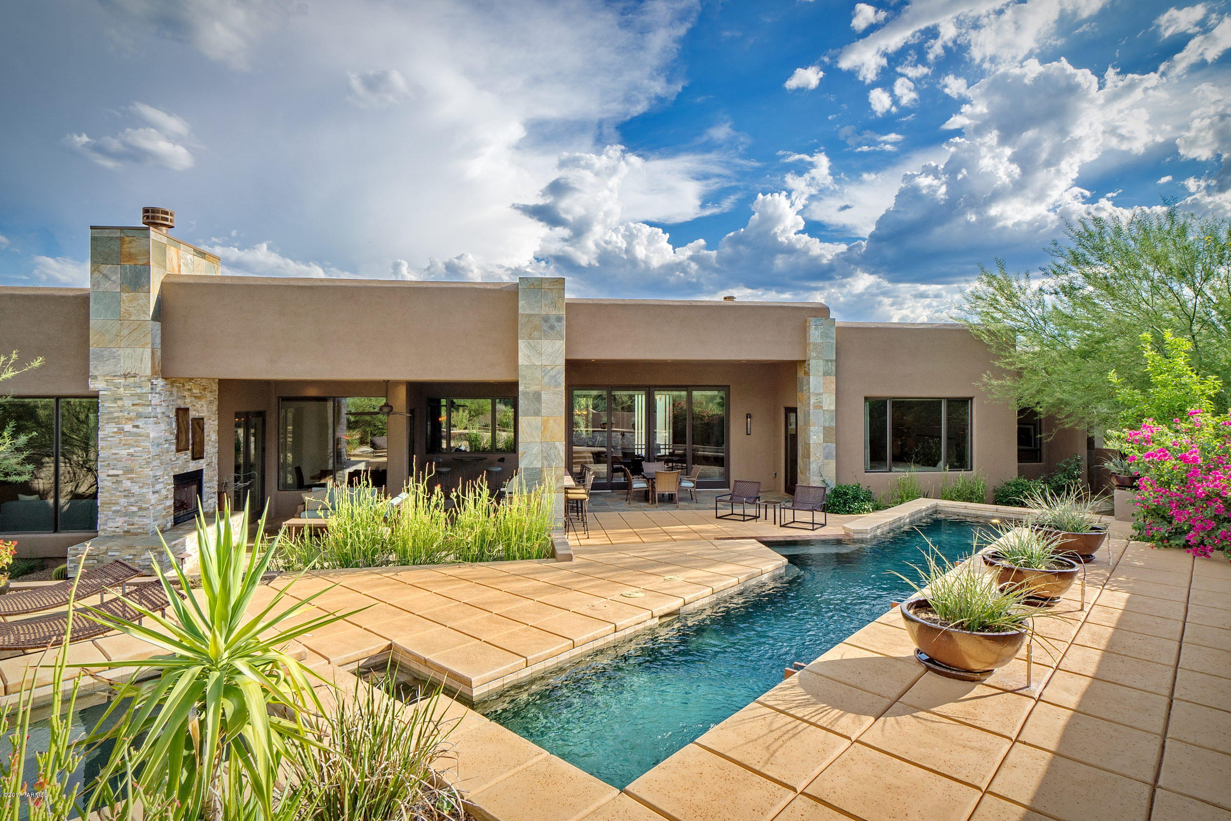THIS EXCEPTIONAL PRIVATE CONTEMPORARY, TUCKED AWAY WITHIN THE SECONDARY GATES OF PIMA CANYON, PRESENTS A RARE BLEND OF ARCHITECTURAL AESTHETIC & FLUID FUNCTIONALITY. DESIGNED W/ CLEAN LINES, THE ESTATE FEATURES OUTSTANDING ATTENTION TO DETAIL & IMPECCABLE CRAFTSMANSHIP THROUGHOUT. THE OPEN, FLOWING FLRPLN IS COMPLEMENTED BY SOFT TEXTURES & TONES, TAKING ADVANTAGE OF FILTERED NATURAL LIGHT, WHILE OFFERING A PERFECT SENSE OF SCALE & PROPORTION. THE 4,368 SQ FT RESIDENCE (3,674 MAIN + 694 SQ FT GUEST), FEATURES 4 BDRM + DEN & 5 BA. THE INTERIOR TO EXTERIOR TRANSITIONAL SPACES ARE RICH IN MOBILITY, W/ THE CAPACITY TO ENJOY & ENTERTAIN BEING EFFORTLESS, W/ VIEWS THAT EXTEND THROUGH THE GREAT ROOM & OUTDOOR LIVING SPACES, SWEEPING OUT BEYOND THE POOL & INTO THE CATALINA MOUNTAIN RANGE.