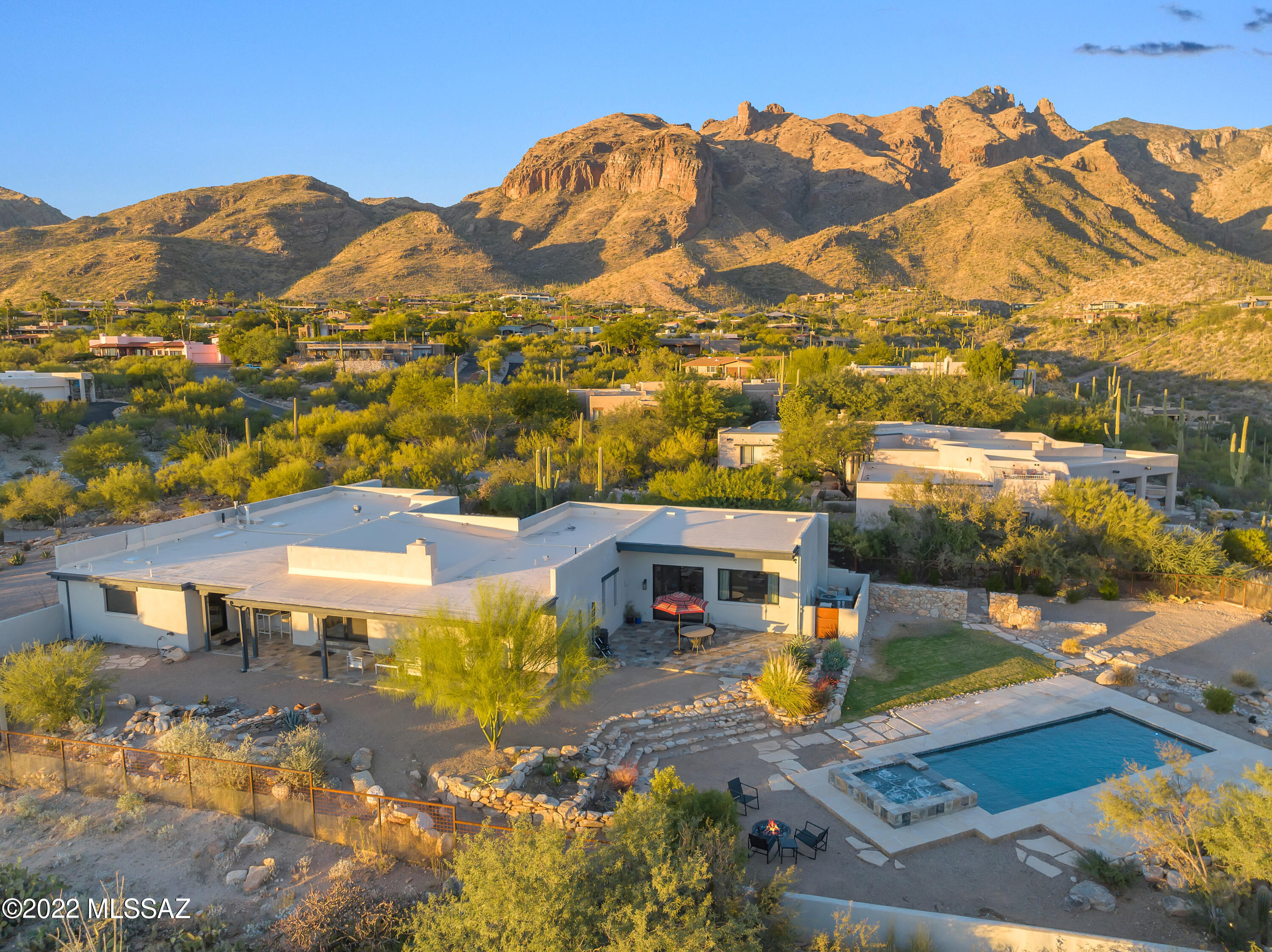 Unparalleled Views in this completely refreshed home in amazing Foothills location. Totally redone in 2020 including new Kraush Architectural windows and doors, New HVAC, New Plumbing, New Electrical,, tankless water heater and new water softener. Design features include, Large tile flooring, all new kitchen & baths, and light fixtures. Kitchen boasts custom cabinets, GE Cafe Matte White Appl, gas cooktop, refrigerator, under counter refrigerator, double ovens, 2 dishwashers. Luxurious Master bath suite with double floating vanities, steam shower, free standing tub and walk in closet. Guest bdrm with ensuite. 500sf Bonus room. Resort like outdoor space, multiple sitting areas, 2021 Presidential Pool and Spa, Water Fall,  Mtn/City Light Views. WILL EXCEED YOUR EXPECTATIONS