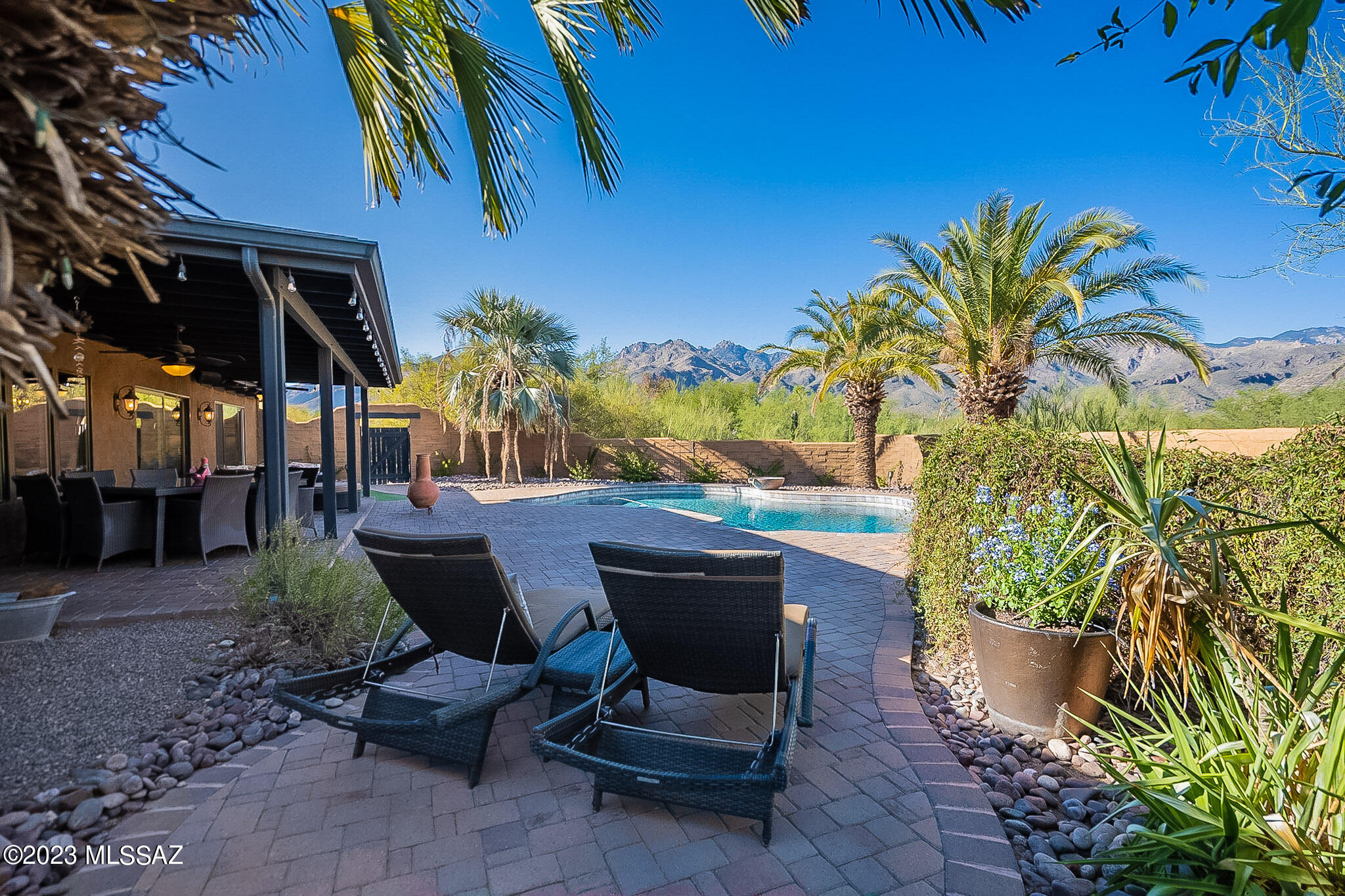 Nestled in the Catalina Foothills is the home you've been dreaming of! Breathtaking views of Ventana/Sabino/Bear Canyons, along w/ Mt Lemmon and Rincon Mtns. Palm trees and bougainvillea line the sparkling pool. Beautiful sunrises/sunsets from the covered rear patio. The front courtyard welcomes you with a magical fountain, jasmine, desert plants, built-in seating, and double iron entry door. Renovated in 2016 to an open concept perfect for entertaining. Countertops Brazilian slab granite, flooring wood-look ceramic tile. Farmhouse sink, stainless appliances, and amazing views. Bedrooms wired for wall mounted TVs. Land surveyed in 2021, room to expand garage or add guest house to this .84-acre property. Rachio Watering System w/ App. HOA voluntary. TEP Solar Program. Catalina Foothills SD-16. Minutes to Sabino Canyon NP, shopping, restaurants, golf, tennis, and bike trails. Welcome Home! Owner/Agent