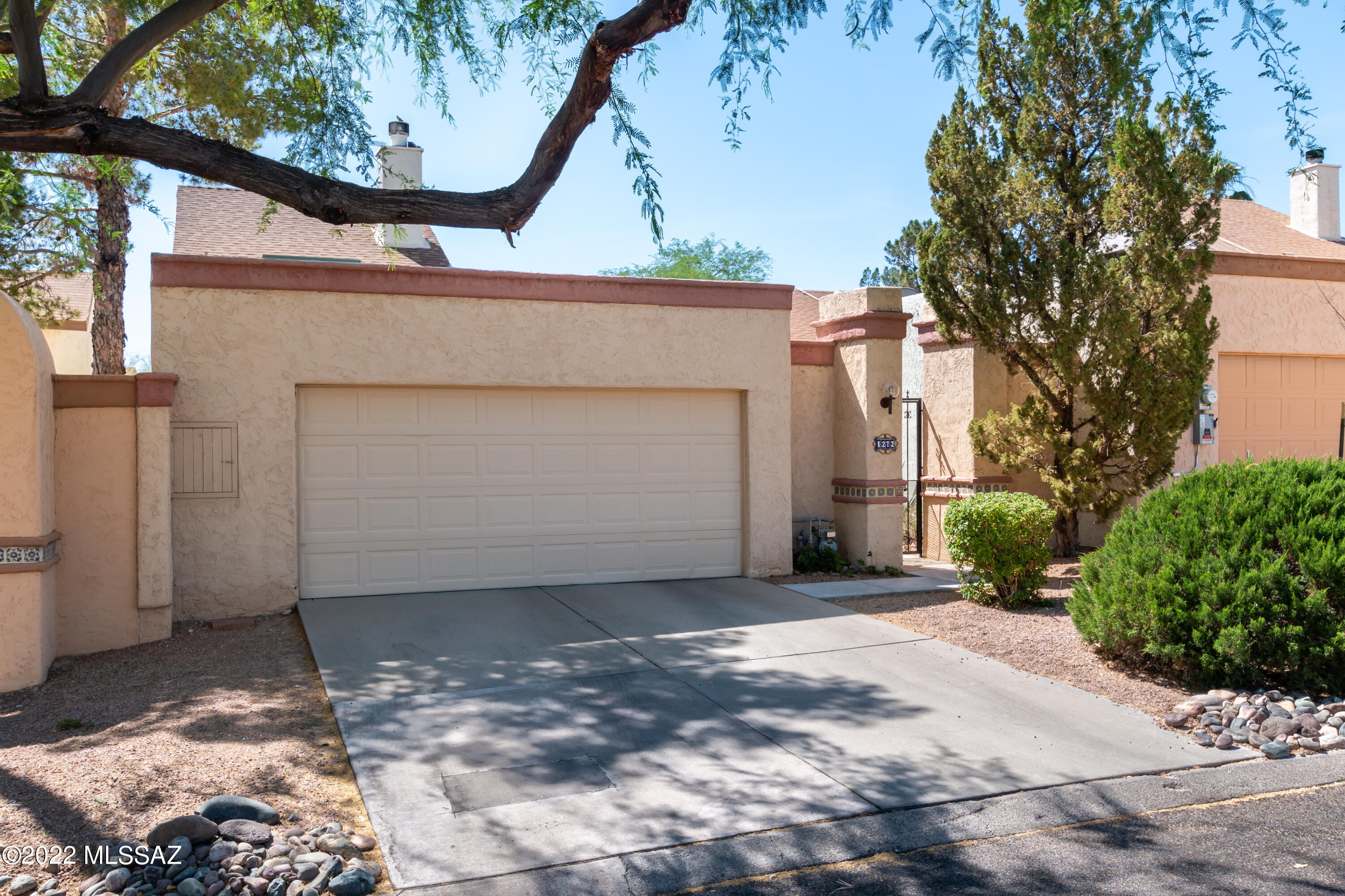 Here's a great opportunity to own a home in Saddlewood Villas and be close to everything...great hiking trails and a variety of other activities offered in this great location...Minutes away from downtown Tucson, Pima College and the University of Arizona. The home is immaculate with great storage and fine touches with tile in all the right places.  The bright interior also features vaulted ceilings, updated kitchen and fireplace in the family room.  Mountain view off of the elevated brick patio and highwalls for privacy.  All this and you are across from the beautiful community pool.