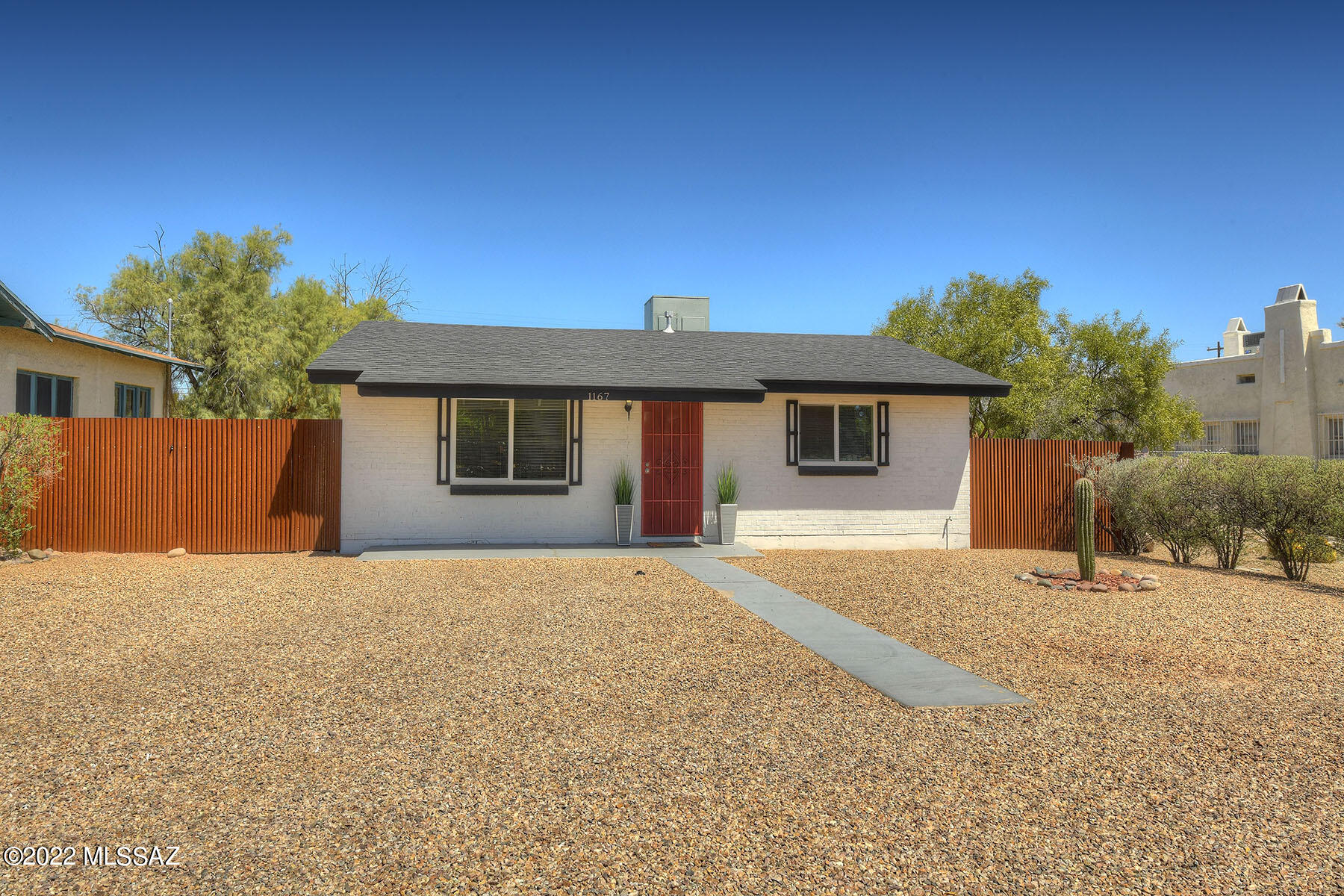 Great Opportunity Mid Town, This 4 bedroom/3bath home located next to the University of Arizona & University Medical Center has endless possibilities!!  Beautifully appointed to include ceramic tile flooring throughout with carpet in the bedrooms, the kitchen features sparkling quartz countertops, stainless steel appliances, large breakfast bar, & custom cabinets. This home has a split bedroom plan with a family room/den that boasts French doors that lead to the Patio and a large backyard. The master suite features a walk-in closet, huge subway tile shower, dual sinks, and plenty of space! Perfect for Student housing or primary residence centrally located close to shopping, restaurants, just down the street from the U of A and the Mountain Ave. Bike Path! Put this on the list as it won't l