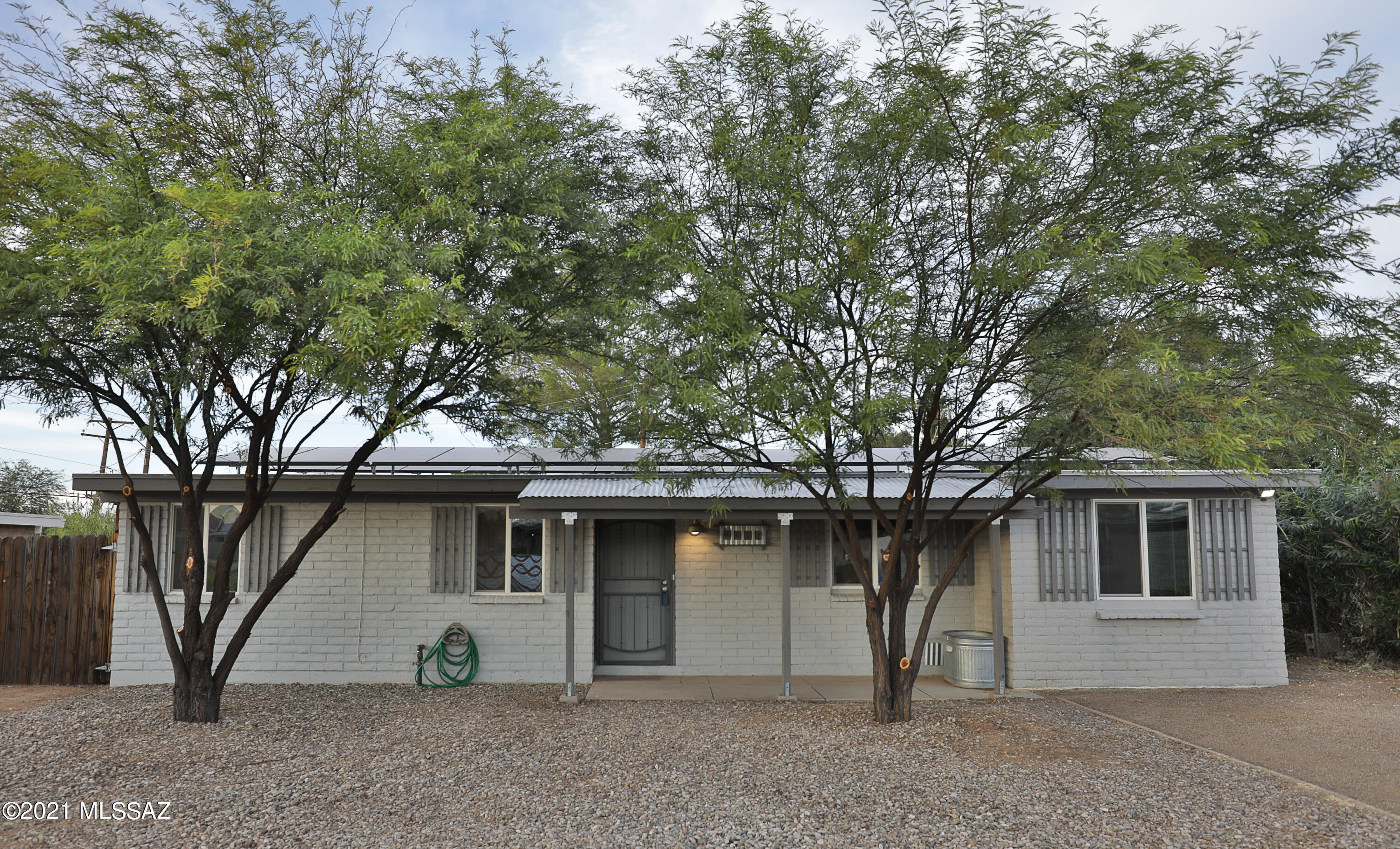 Stylish and updated 3bed/2bath home. Delightful designer details throughout. Bright and open great room. Kitchen with stainless steel appliances and hickory cabinetry. Whirlpool low-profile gas range. Elegant breakfast bar. French doors open to a resplendent full-length poured-concrete covered patio overlooking a lushly planted backyard and sparkling pool. Beautifully tiled bathrooms with vessel sinks. Cool speakeasy door leads to a large bonus area and laundry room. Leased solar. Tankless water heater. More!