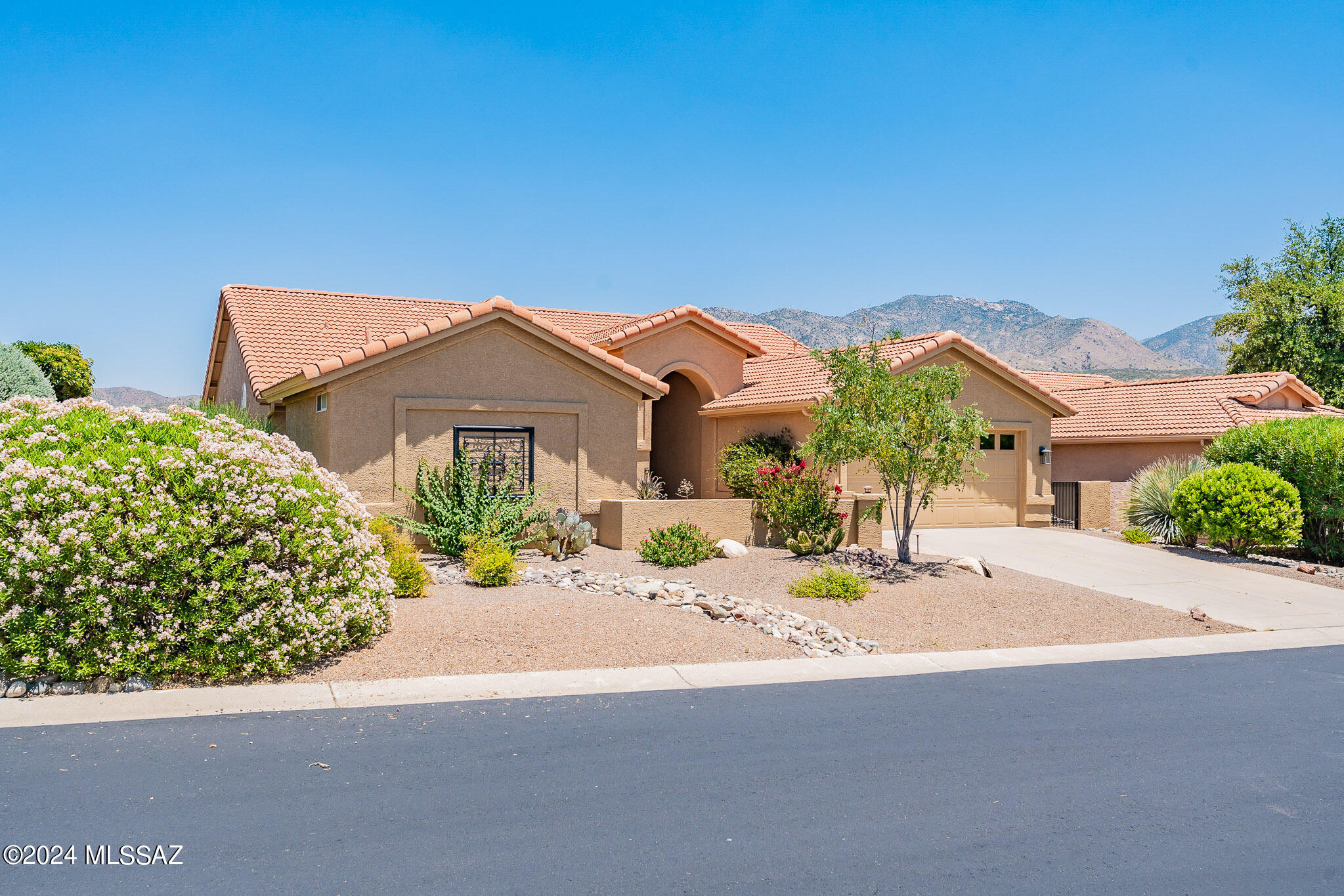 A BEAUTIFUL TOTALY UPGRADED GREAT ROOM SEDONA LOCATED ON A HIGH PREMIUM LOT THAT AFFORDS OUTSTANDING MOUNTAIN & GOLF COURSE VIEWS. LOCATED HIGH ABOVE THE CATALINA 7th HOLE. THE HOME OWNER ENJOYS OPENESS & QUIET SERENE PRIVACY FROM THIS N.E. PATIO. LOTS OF UPGRADES INC: REMODELED KITCHEN   W/GRANIT COUNTERS & CHERRYWOOD CABINETS W/A SPACIOUS  ADJOINING OFFICE AREA & REMODELED BATHS, TILE FLOORS;EXT.GARAGE; FLAGSTONE FRONT WALK & FLAGSTONE EXTENDED BACK PATIO, LARGE RAMADA MAKES THIS HOME AN ENTERTAINERS DELIGHT. HUGH GOLF CART GARAGE HAS LOADS OF EXTRA STORAGE BUT HAS PLUMBING FOR CASITA CONVERSION
