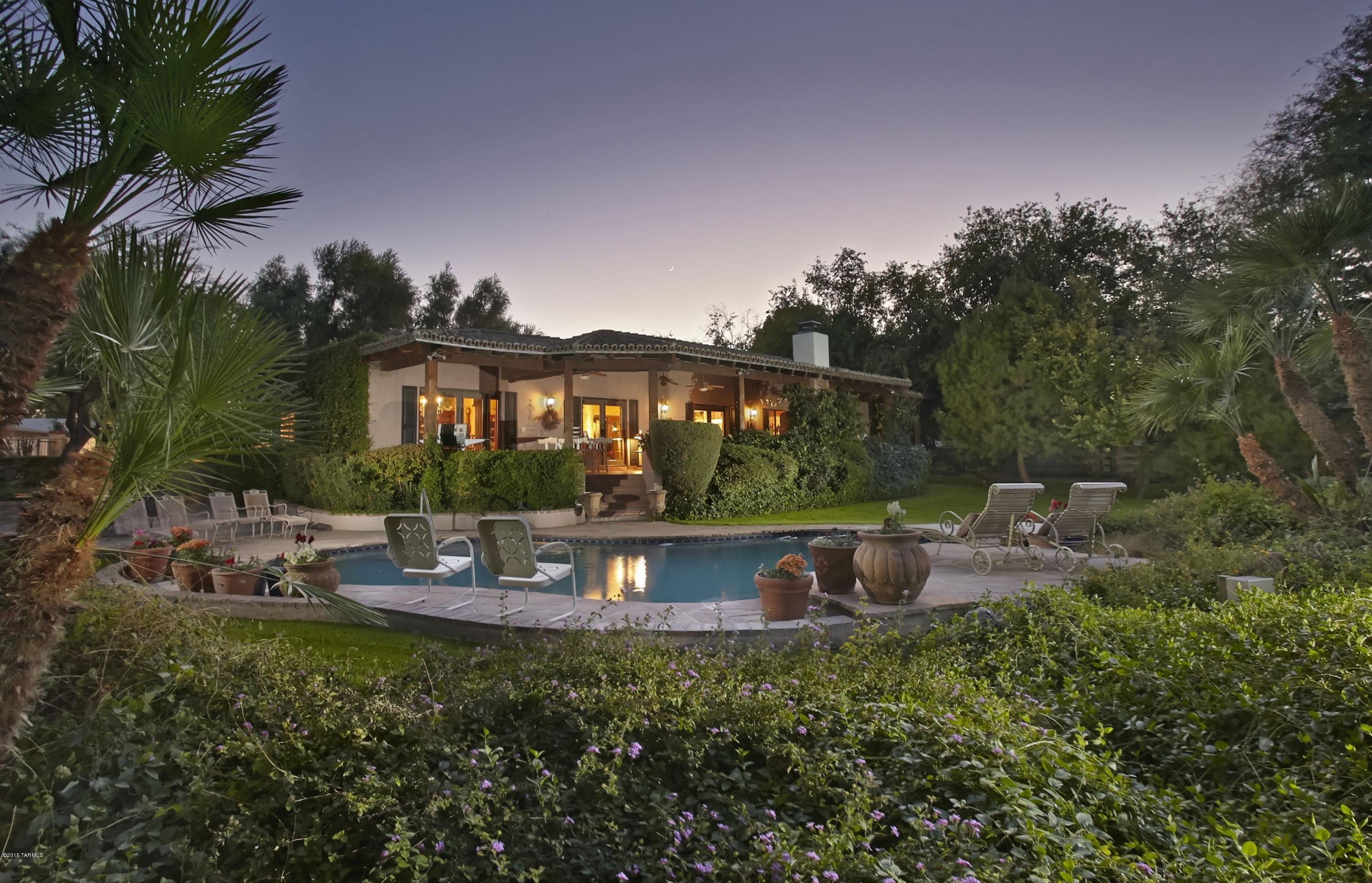 A HOME HAS LONG BEEN THOUGHT OF AS A PLACE OF REFUGE, EXEMPLIFIED BY THIS PRIVATE & SECLUDED ESTATE, SITUATED ON OVER 3 1/2 ACRES. ORIGINALLY BUILT FOR CARLOS & BETTY RONSTADT IN 1961 & OWNED BY THE PRESENT FAMILY FOR OVER 48 YRS, THIS QUINTESSENTIAL TUCSON HOME IS UNIQUELY SITED TO OFFER UNFETTERED & DRAMATIC CATALINA MTN VIEWS, STRETCHING OUT OVER THE LUSH MATURE GARDENS. CONSTRUCTED OF BURNT ADOBE & COMPLETELY REMODELED IN 2002, THIS CLASSIC & COZY FLR PLAN CONTAINS WARM PUBLIC SPACES, PRIVATE CRTYRDS & SPACIOUS VERANDAS, W/ FEATURES INCLUDING: TERRAZZO FLRS, STACKED ROCK FIREPLACE, OPEN WOOD BEAMED CEILINGS IN KITCHEN, CUSTOM CABINETRY, GRANITE COUNTERS, VIKING COOK TOP,  AS WELL AS POOL, PRIVATE WELL, HORSE PROPERTY & MUCH MORE. REPRESENTING THE FINEST OFFERING OF TUCSON LIFESTYLE!
