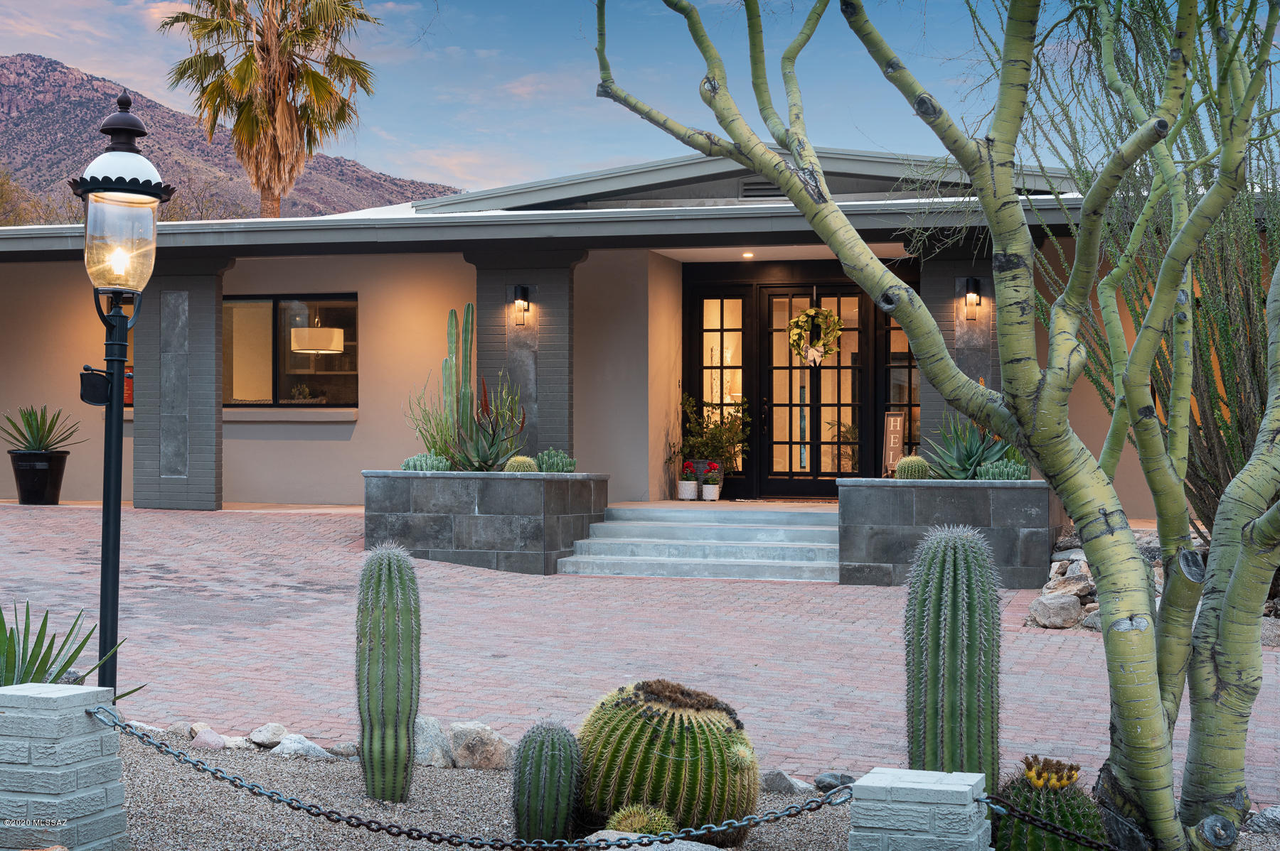 Range price $899,000-$925,000. Completely renovated home situated on 1.05 acre lot within guard-gated Skyline Country Club. Wonderful mountain views.  Circular driveway w/ pavers at entry. Large metal + glass dbl doors take you into a spacious foyer. New, open floor plan w/ new flooring. Gorgeous new kitchen w/ large center island, light-colored granite, white cabinets complimented w/new SS appl's. New coffee bar in kitchen area w/ matching finishes. Space for informal + formal dining. All new pantry cabinets were added. Large wet bar in the great room w/ impressive backsplash, granite counters, custom cabinets, wine ref. + sink. Great rm w/ huge windows to enjoy the mtn views. Lovely stacked-stone FP. An extra bathroom was added to create an en-suite guest room w/ FP + deck w/ city views Generous Master Suite w/ custom built walk-in closet the size of a bedroom and sliding glass doors to back patio. Brand-new Master Bath with large glass enclosed shower, dual vanities and soaking tub. Located in highly desirable Skyline Country Club Estates where members enjoy Golf, Tennis, Work-out Facilities and a Busy Social Calendar! See Documents Tab for more detailed information on the renovation of the home.